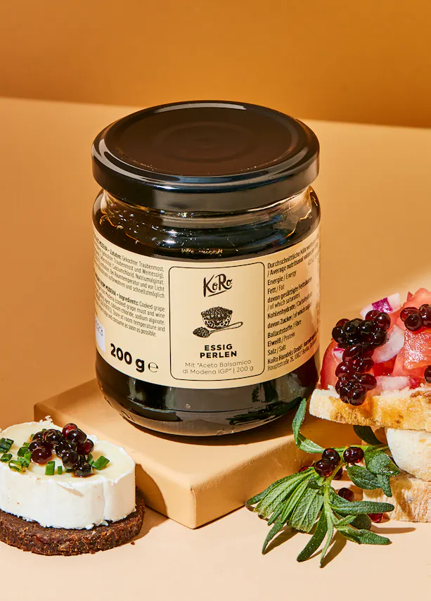 a jar of esseio degli olivi sits on a table