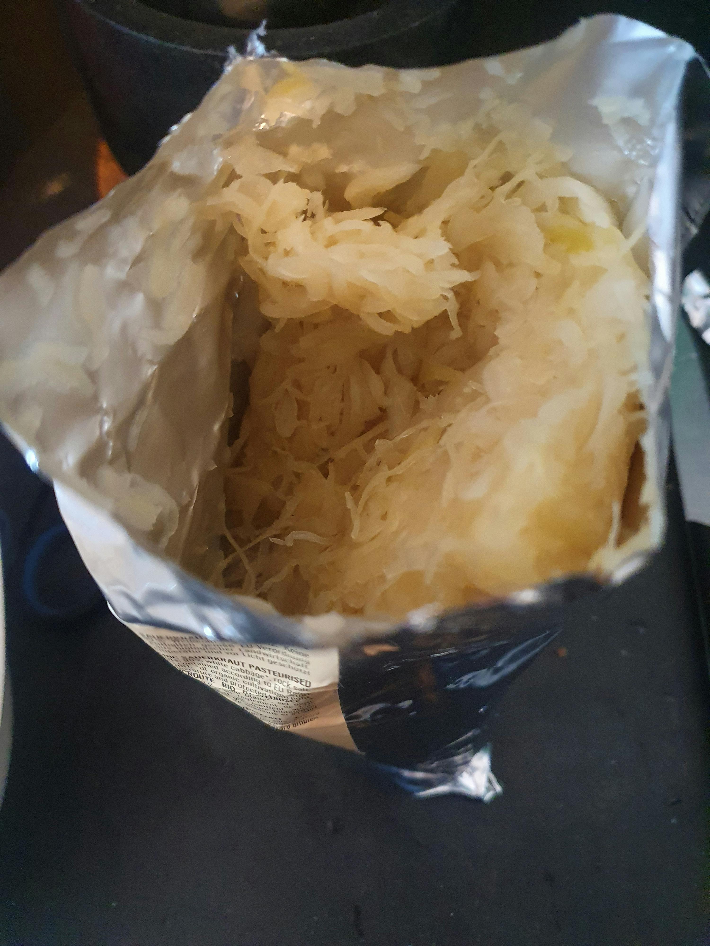 a bag of shredded potatoes with a label that says ' aluminum foil ' on it