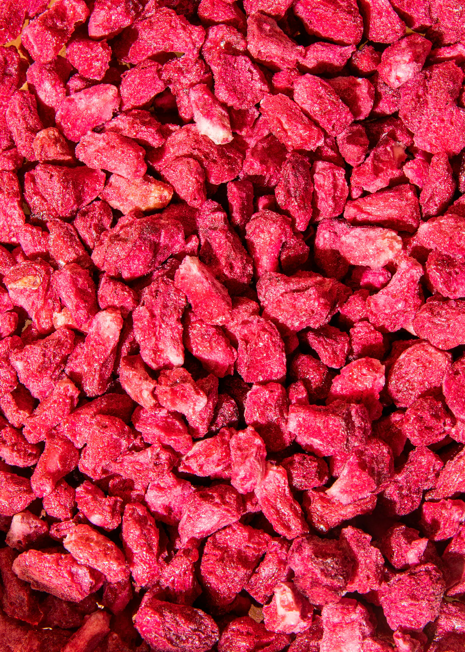 a close up of a pile of red rocks