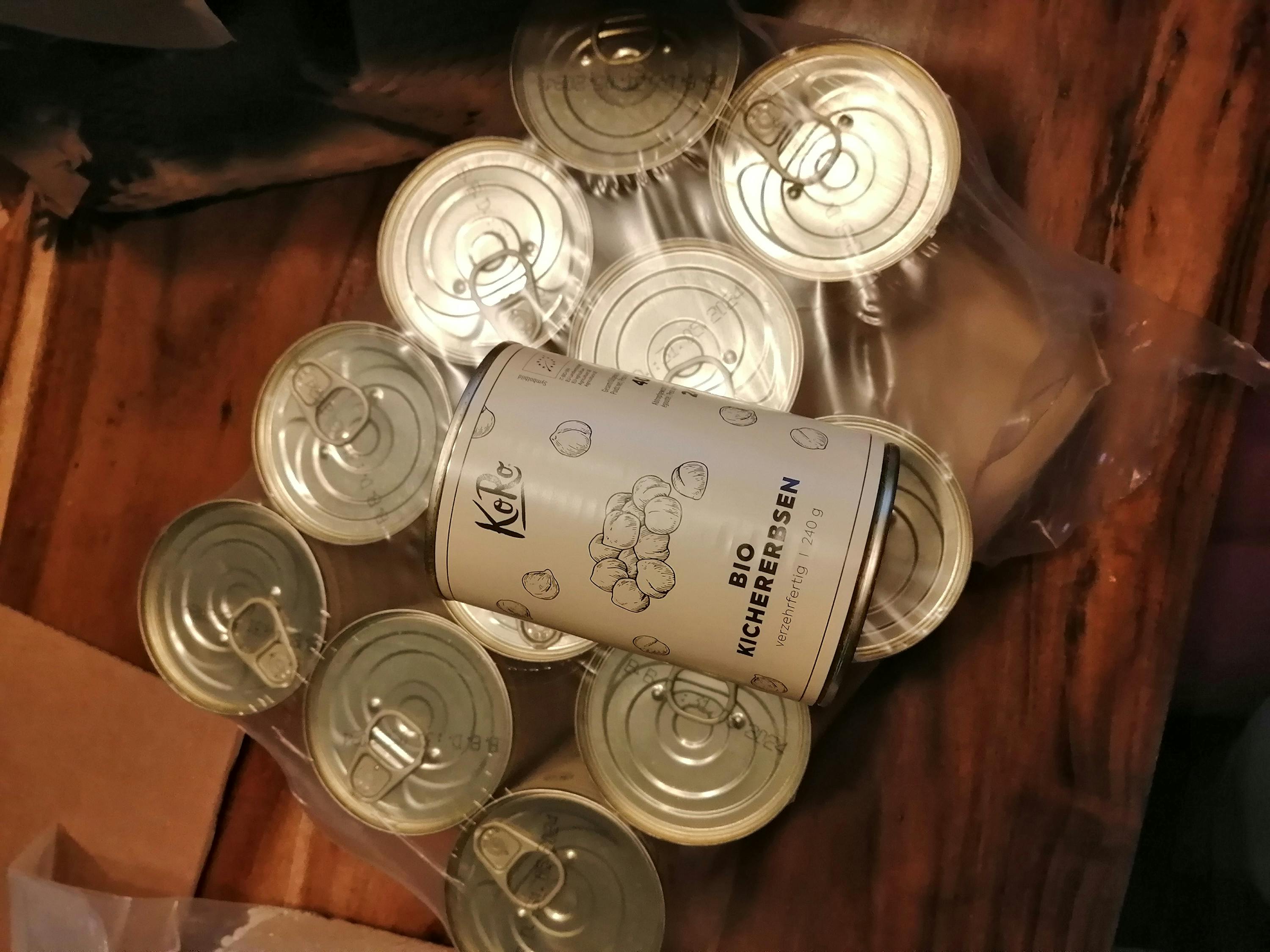 a bunch of cans are stacked on top of each other with one that says " bio " on it