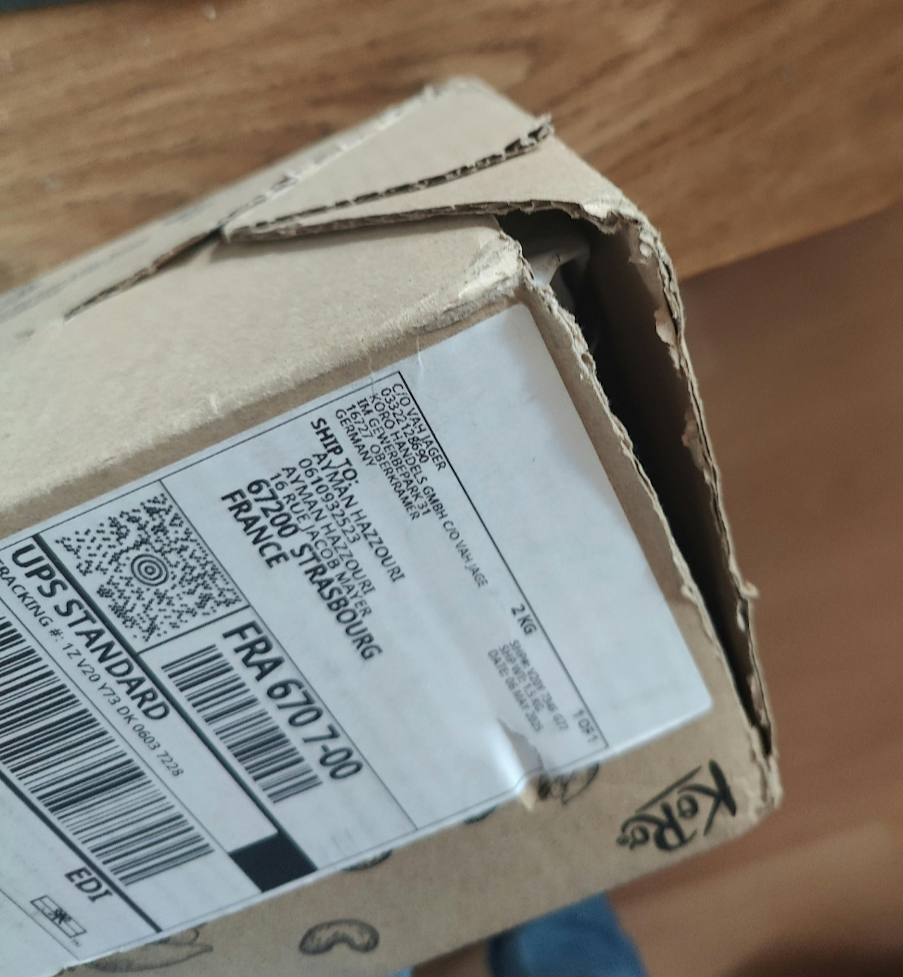 a cardboard box with a label that says ups standard on it