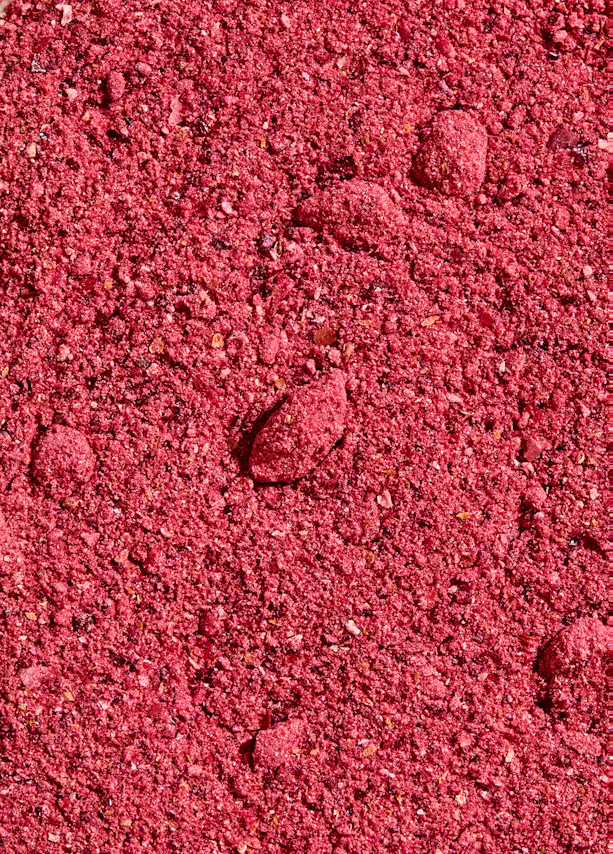 un gros plan d' un tas de pierres roses
