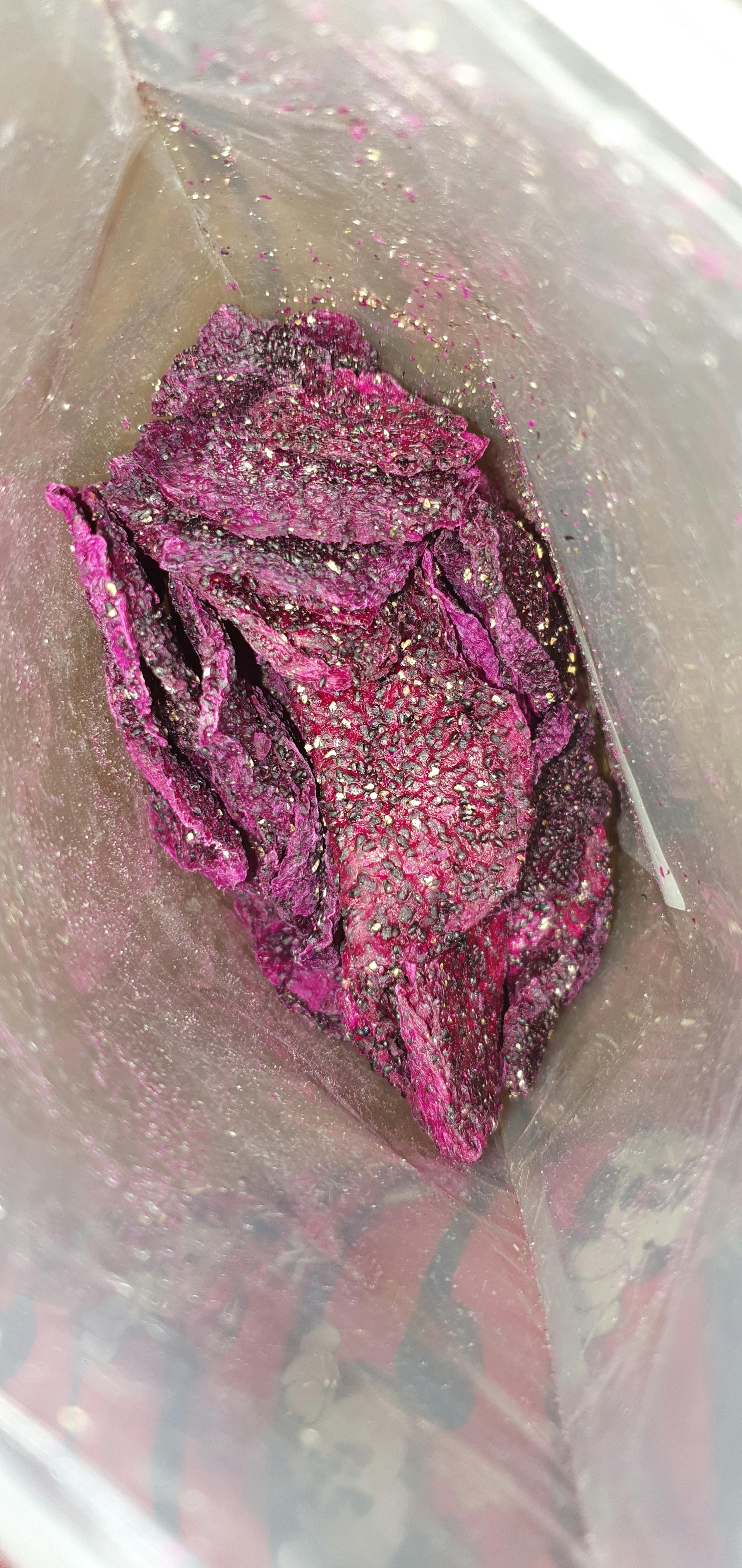 a bag of purple chips with a mickey mouse sticker on it
