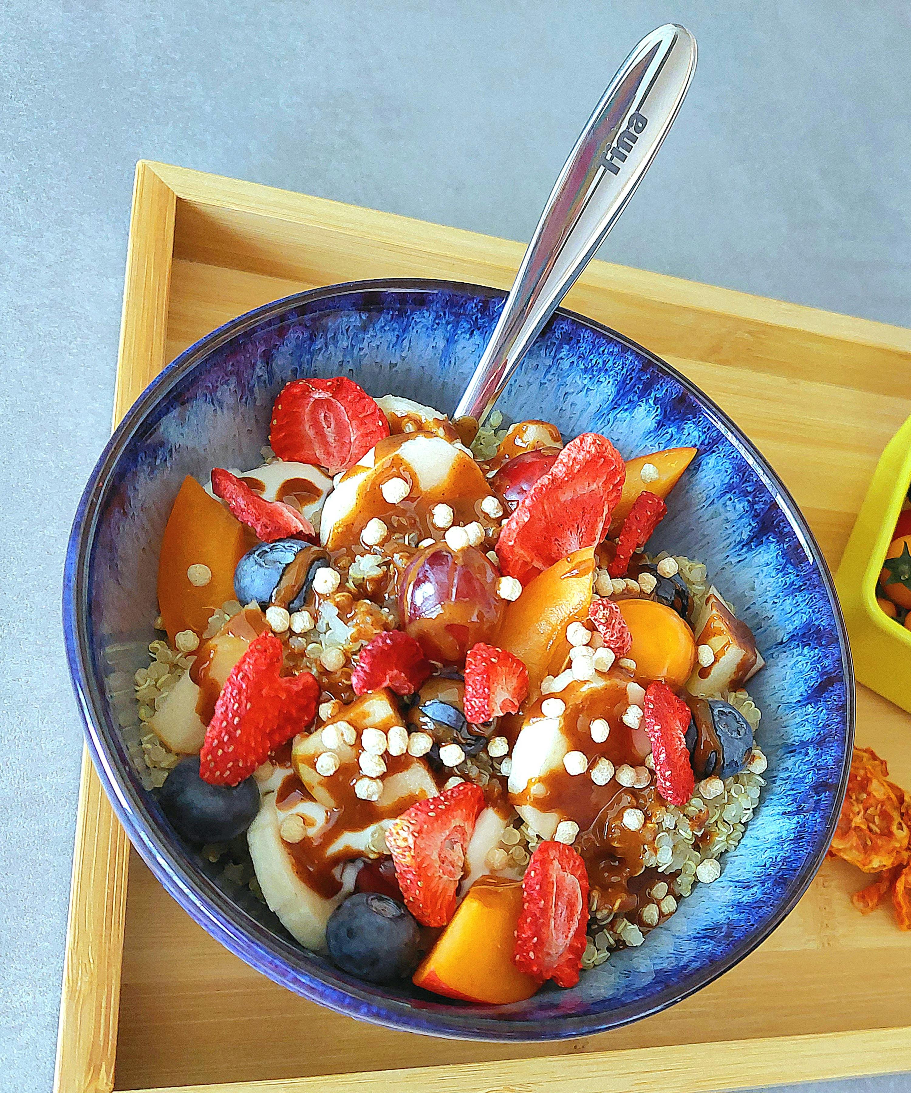 a bowl of food with a spoon that says fire