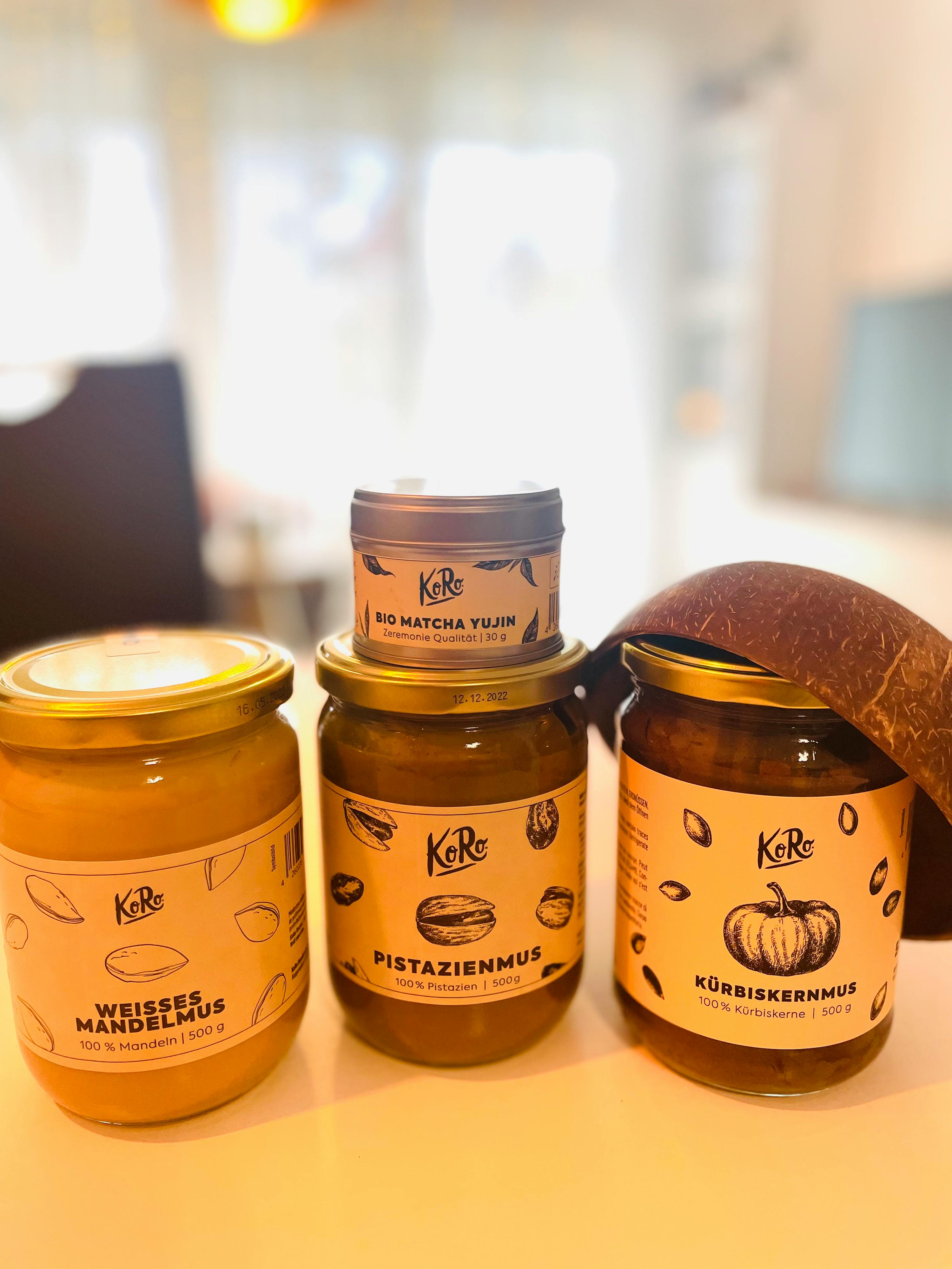 three jars of food including one that says pistazienmus