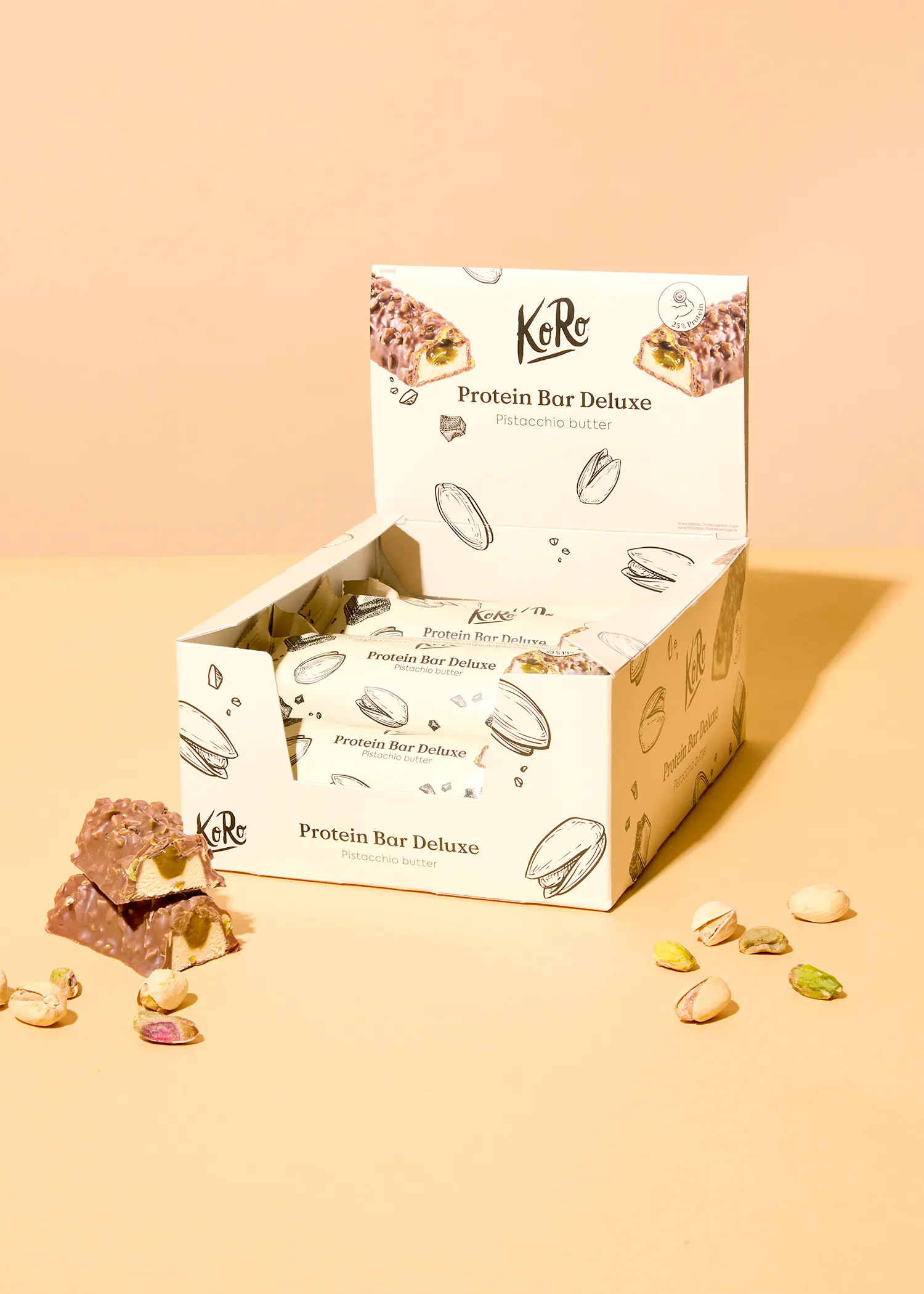 une boîte de barres de protéines de luxe avec des pistaches