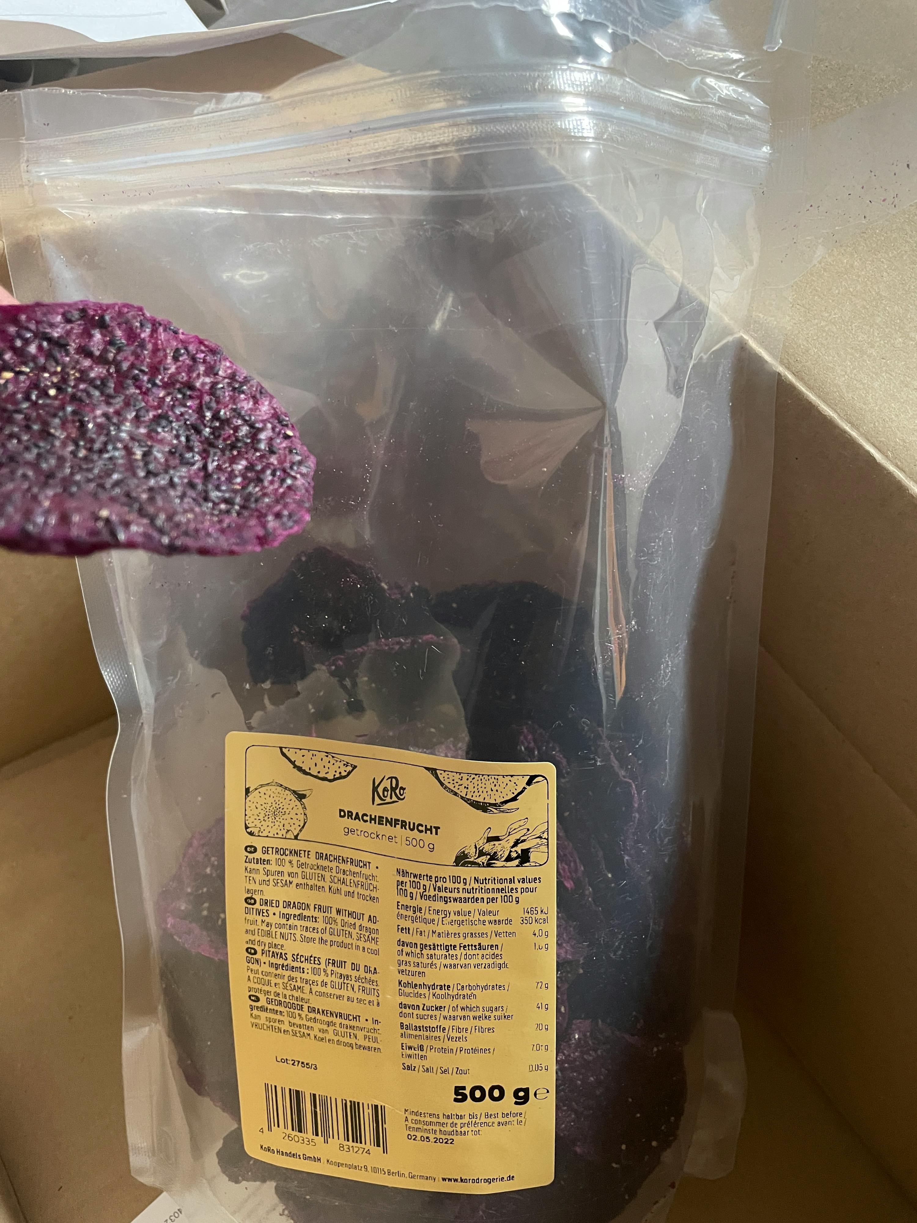 a bag of dried purple dragon fruit sits in a box