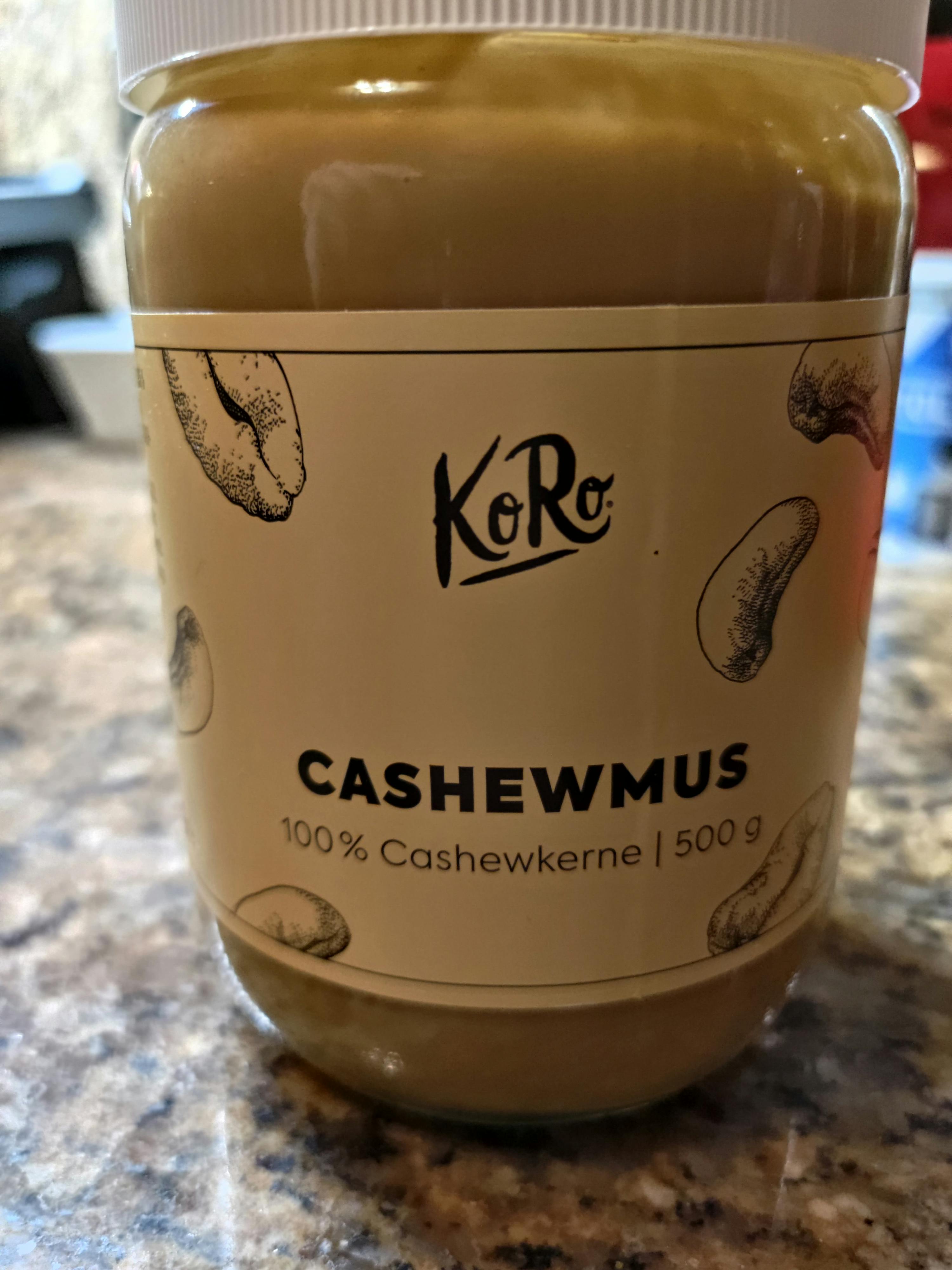 a jar of cashewmus sits on a counter top