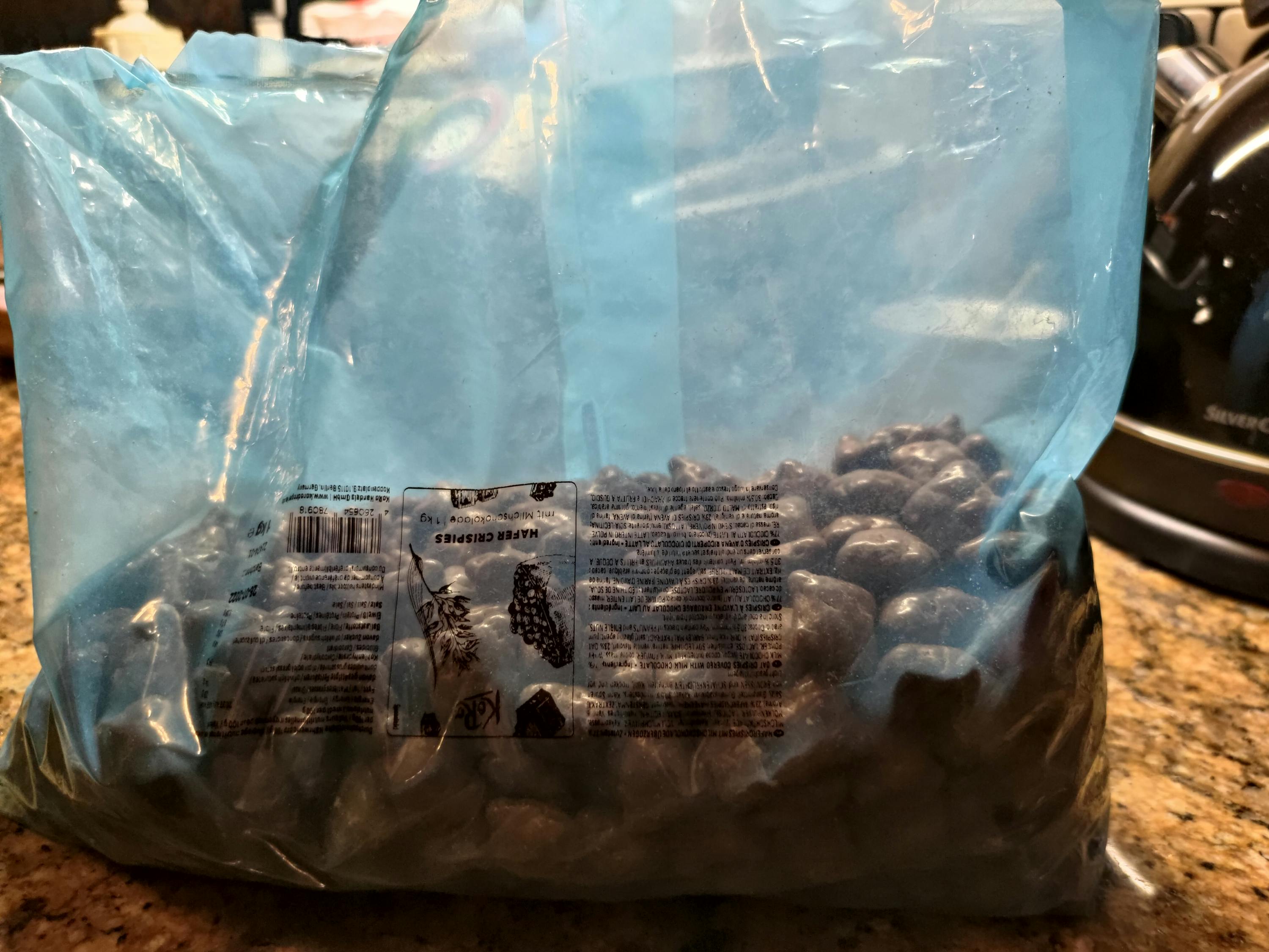 a bag of chocolate covered peanuts is on a counter