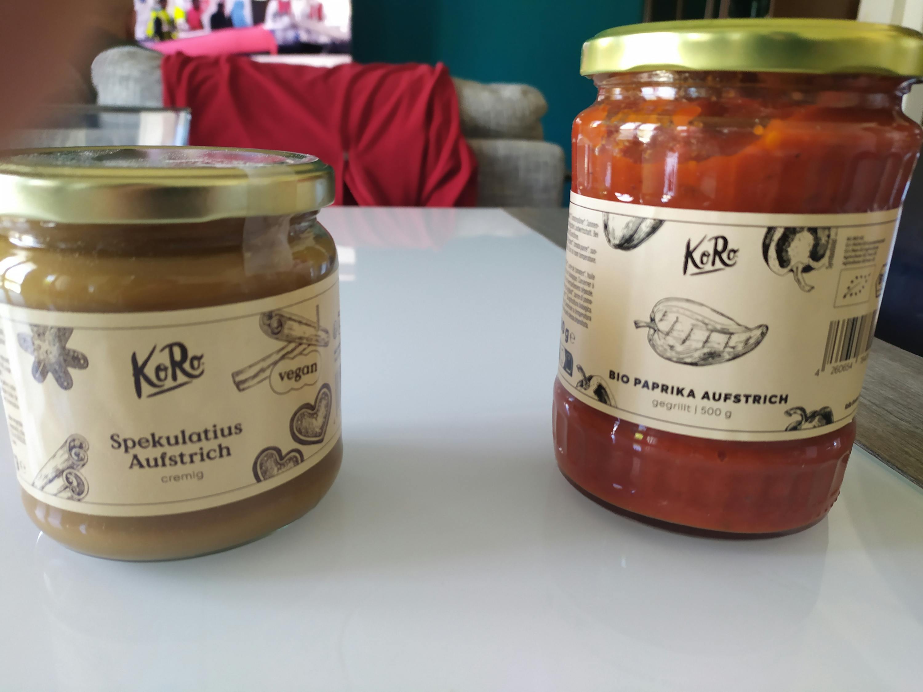 two jars of food one of which is called paprika aufstrich