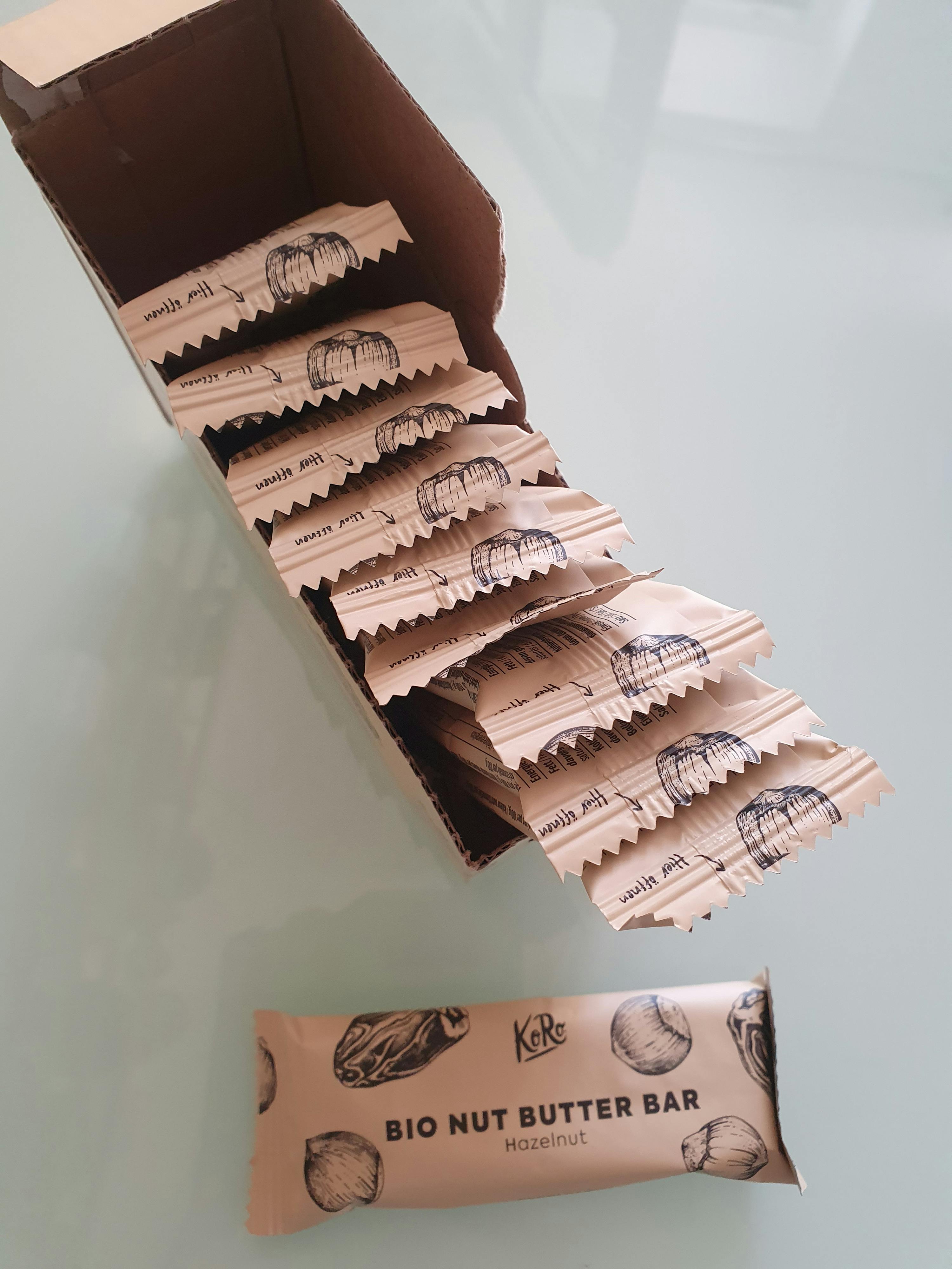 a box of bio nut butter bars sits open on a table