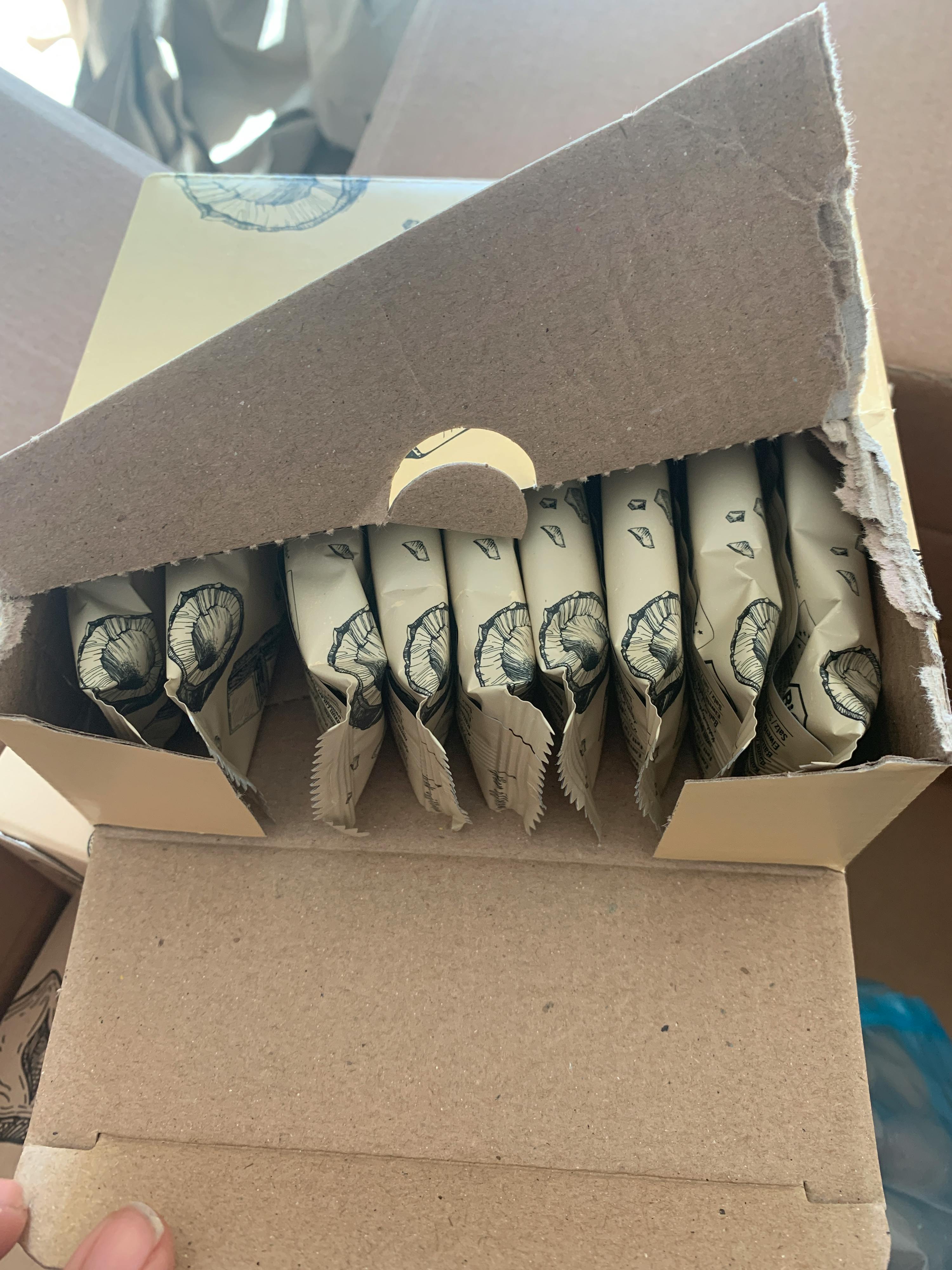 a cardboard box filled with a variety of food items