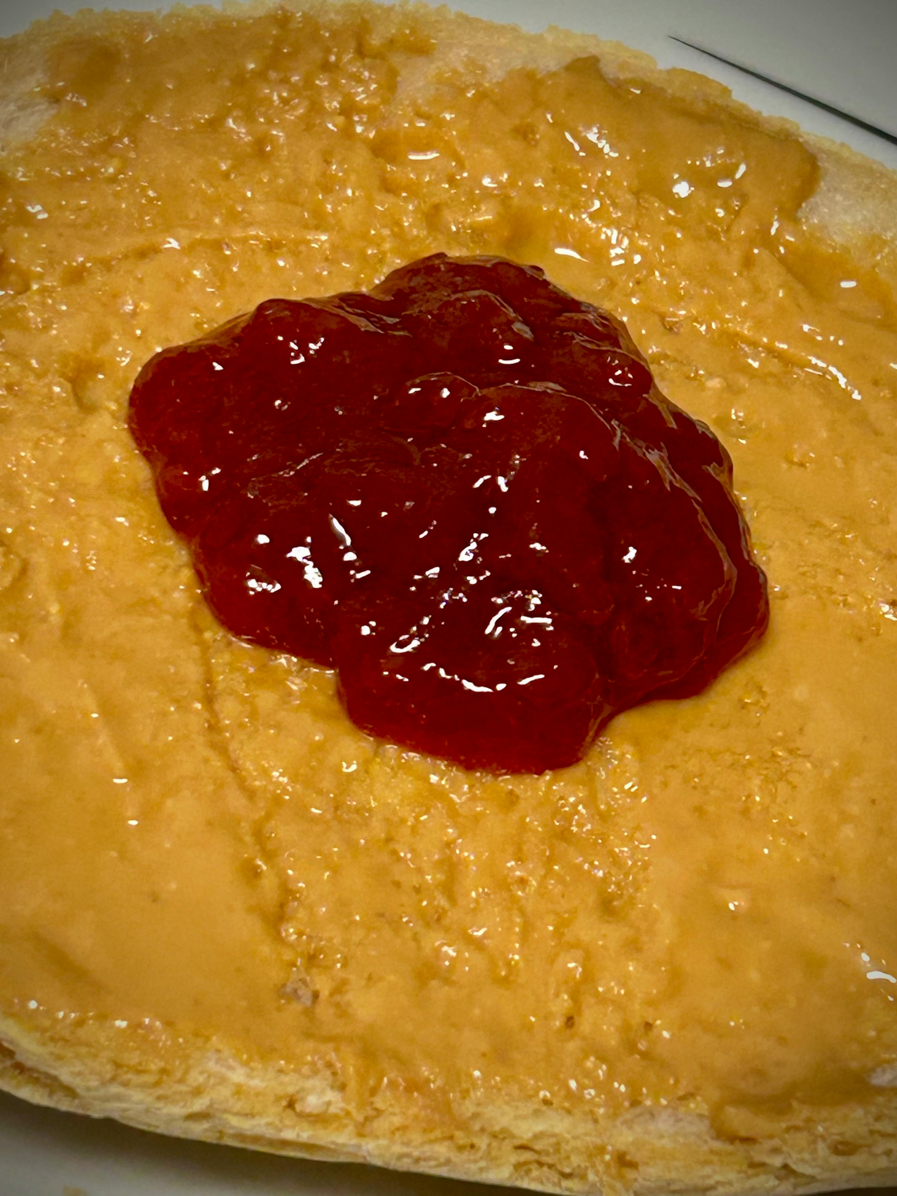 a sandwich with peanut butter and jelly on it