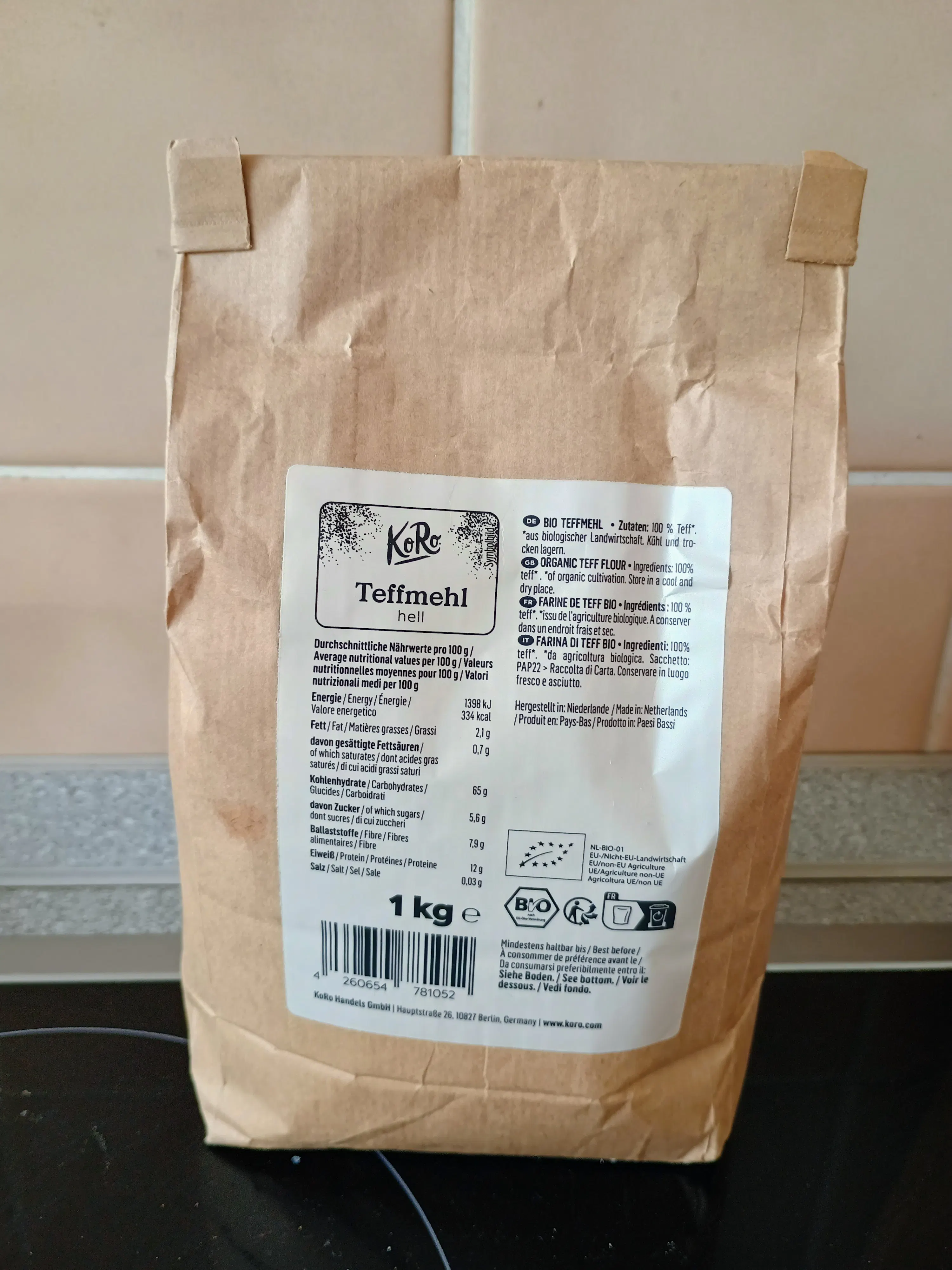a brown paper bag of koro organic light teff flour with nutritional information and product details visible on the front.