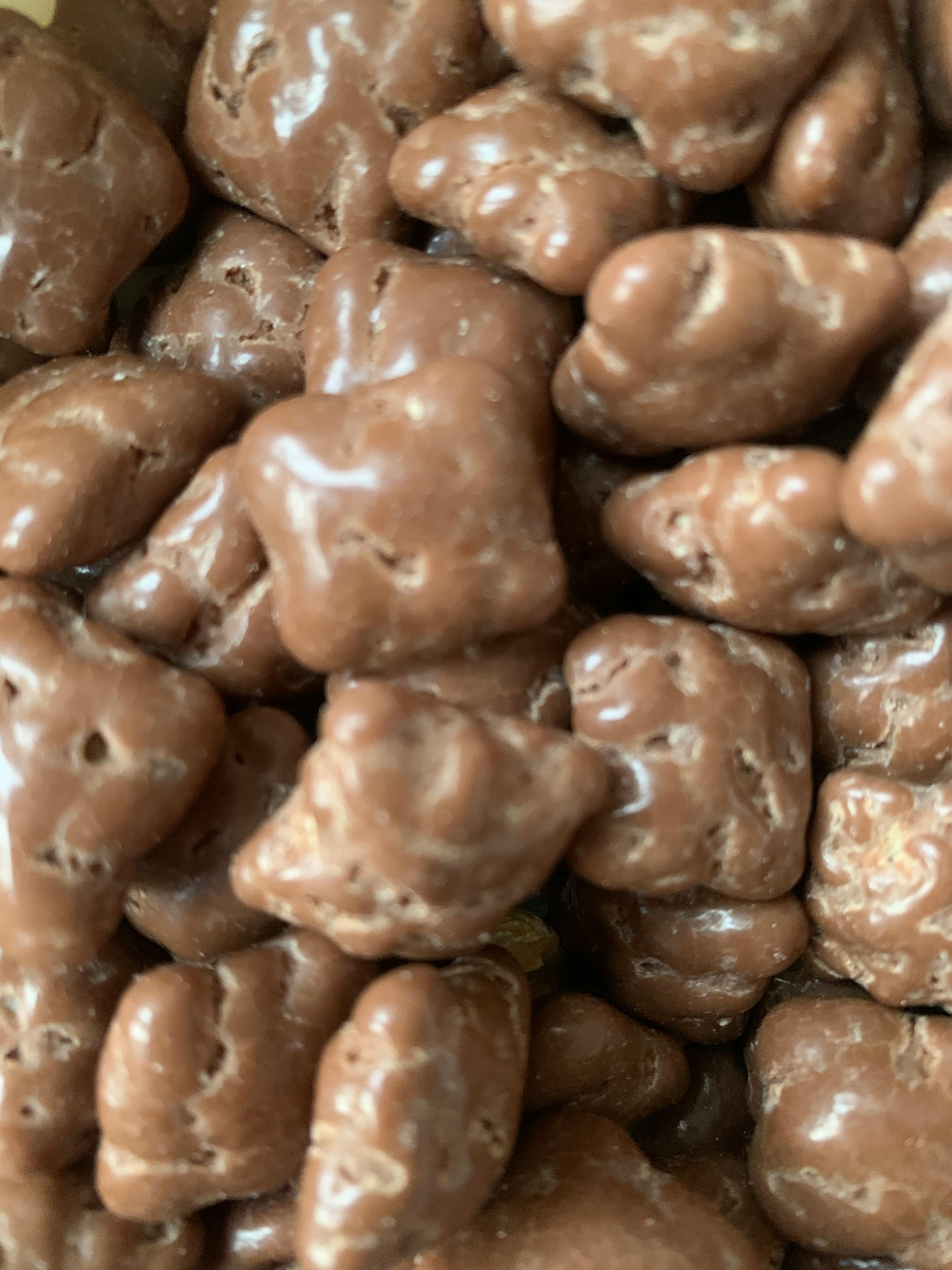 a close up of a pile of chocolate covered pretzels