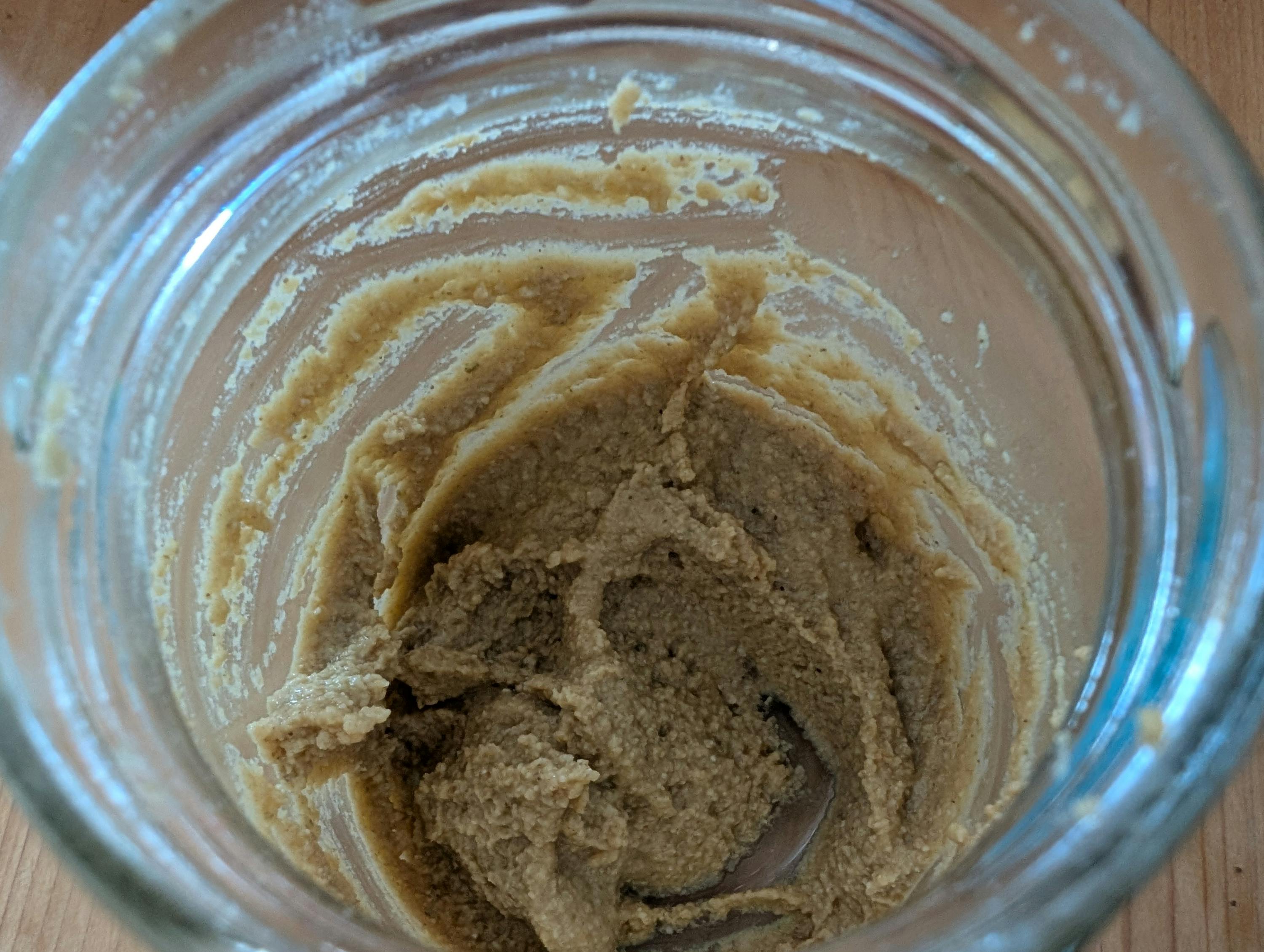 a jar of peanut butter is sitting on a table