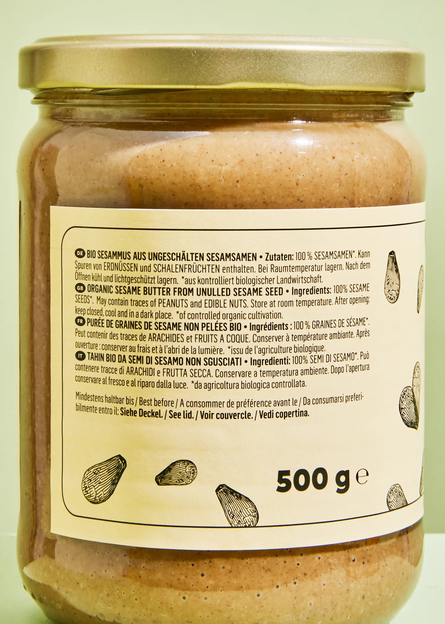 a jar of sesame seeds has a 500 g label on it