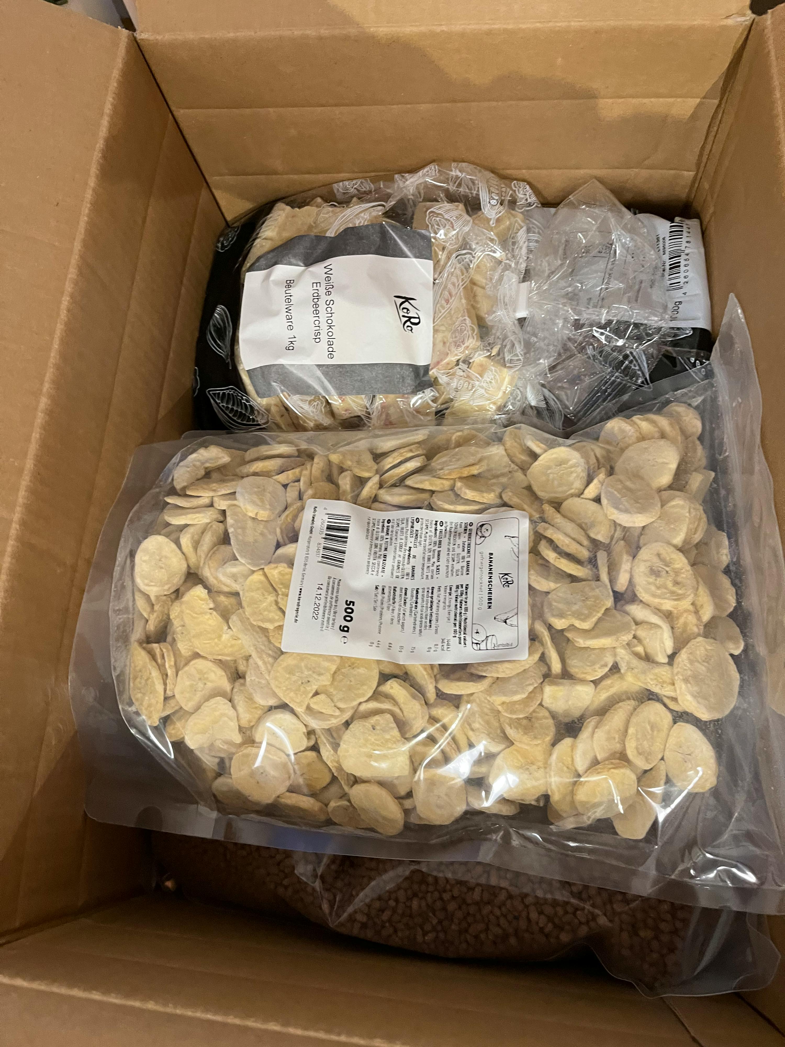 a bag of banana chips sits next to another bag