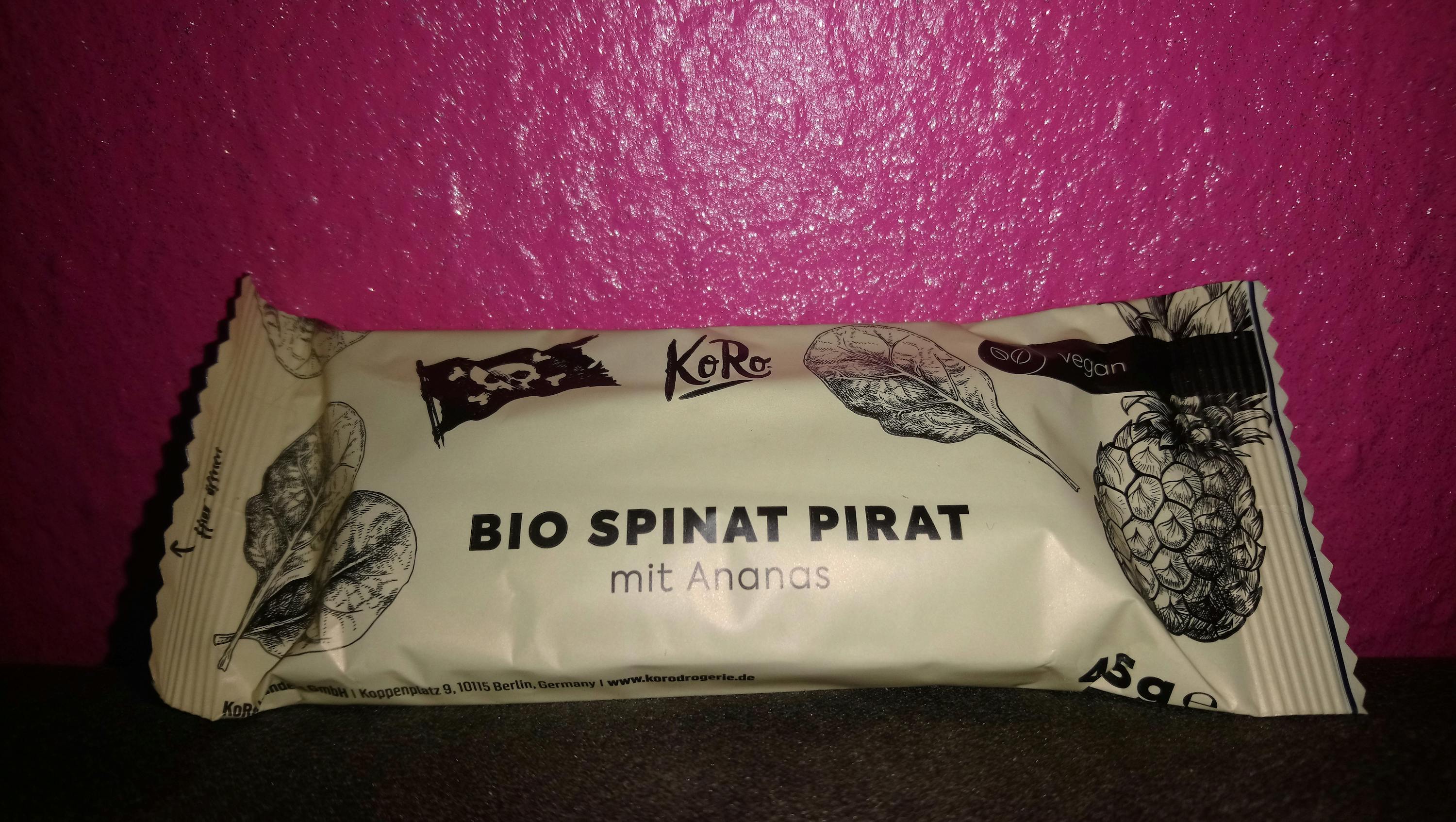 a package of bio spinat pirat mit ananas on a pink background