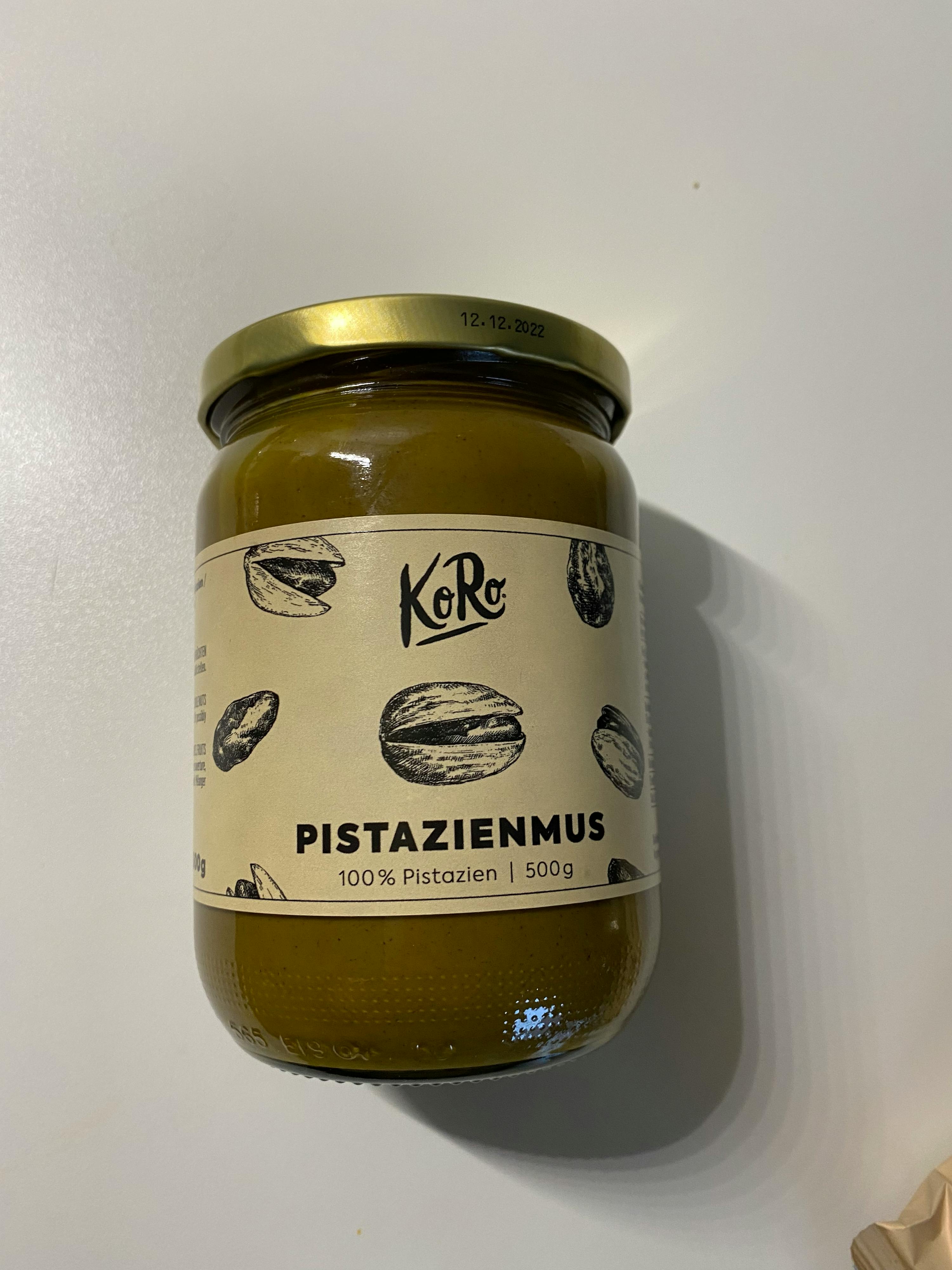 a jar of pistazienmus is sitting on a table