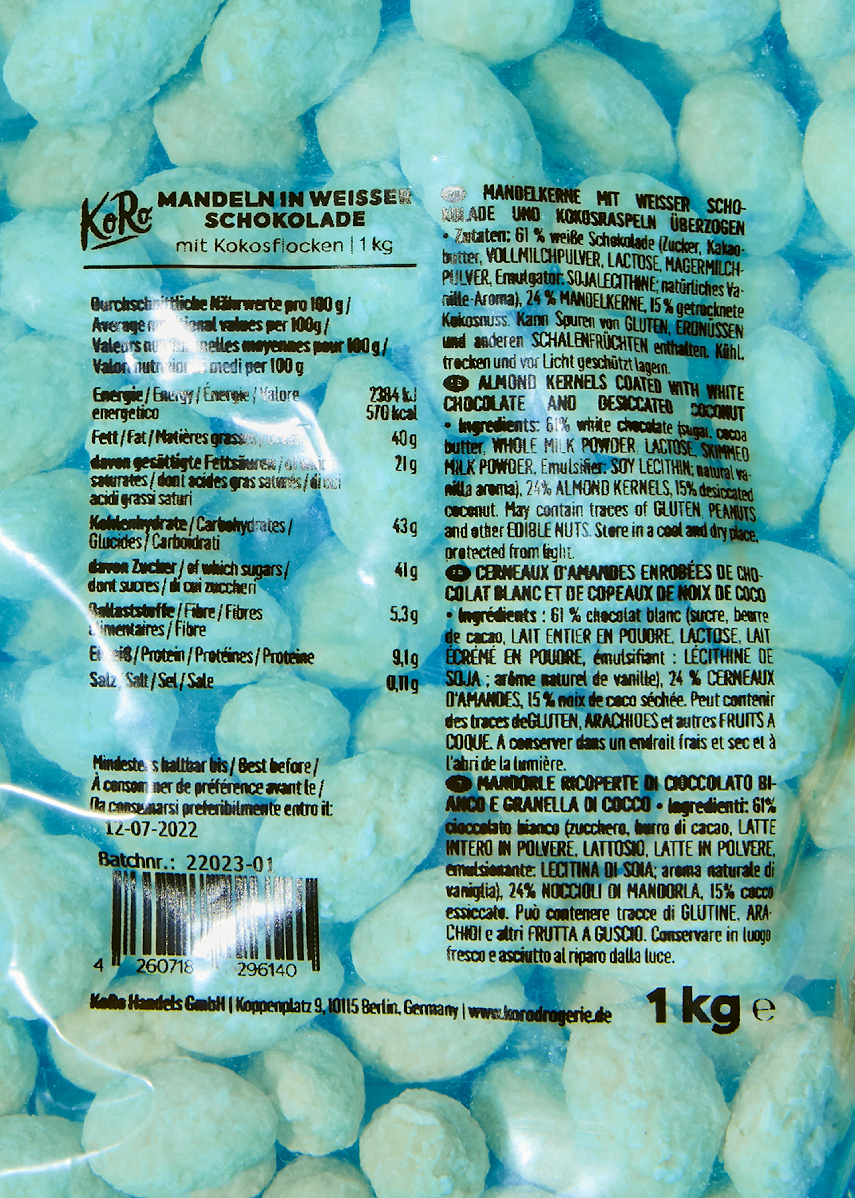 eine Packung mit mandeln in weißer Schokolade mit Kokosflocken