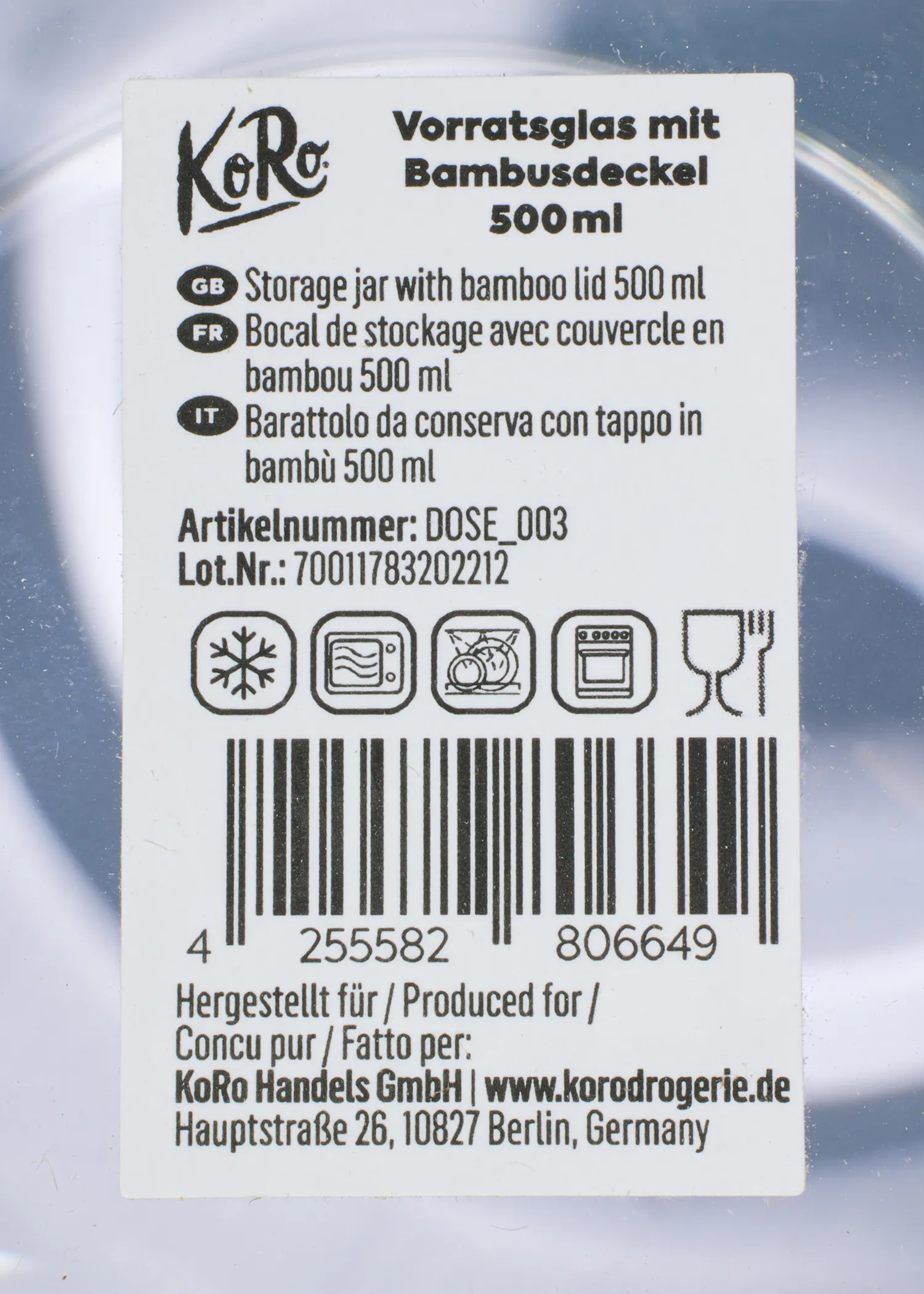 a label for a glass jar with a bamboo lid says " vorratsglas mit bambusdeckel 500 ml "