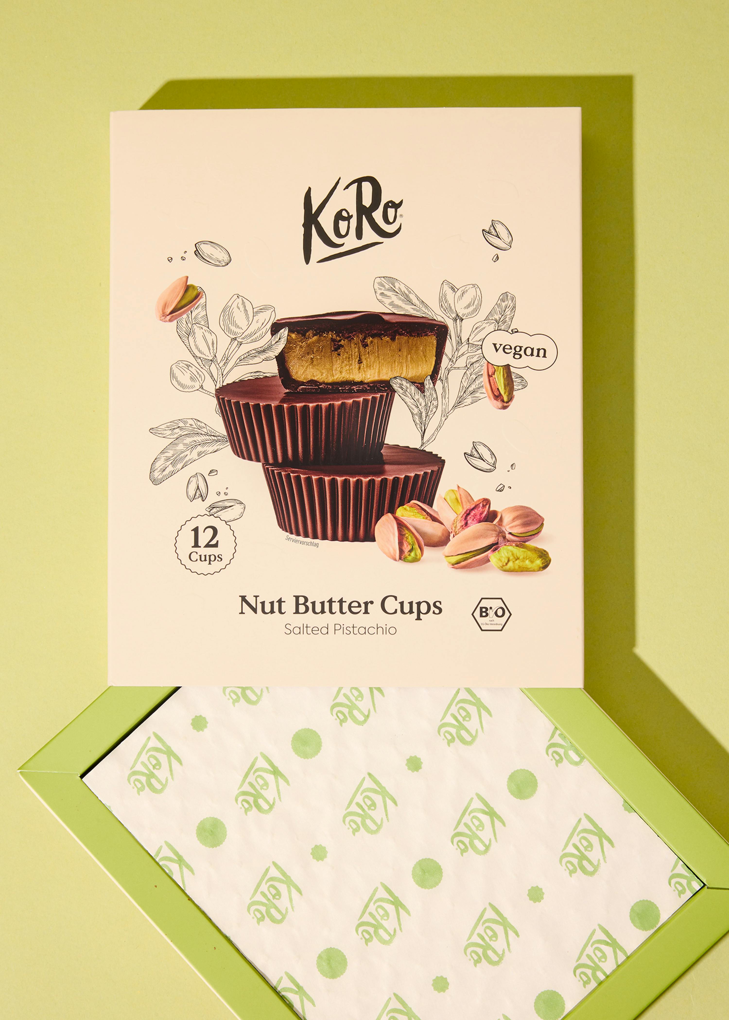 a box of koro nut butter cups with salted pistachio