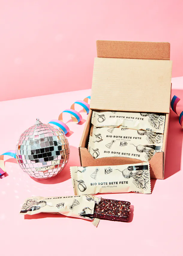 a box of bio rote bete fete bars sits next to a disco ball