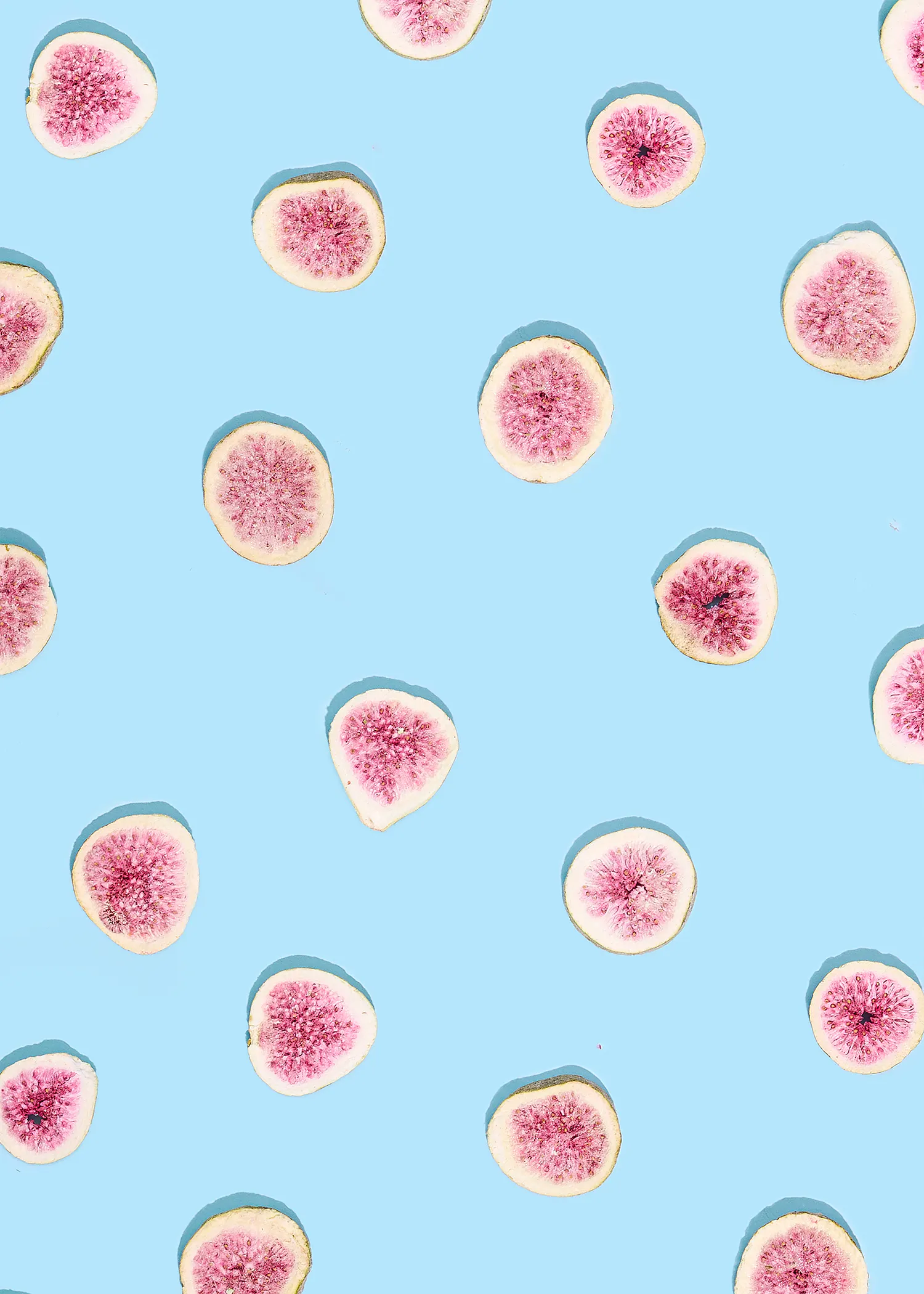 a blue background with slices of figs on it