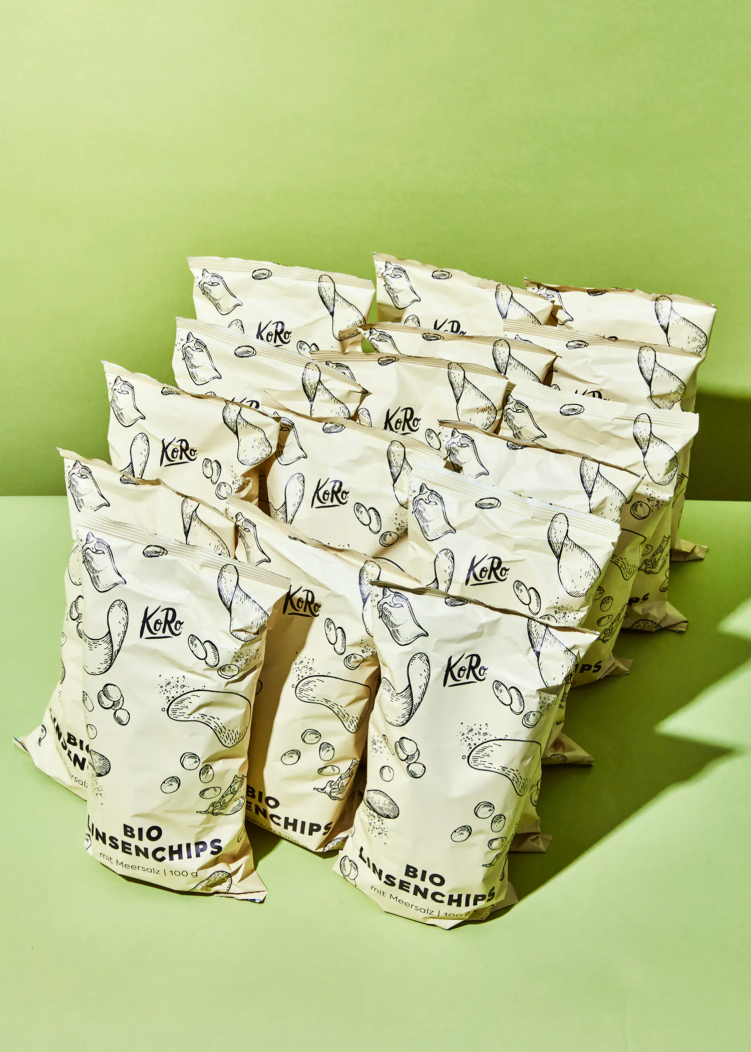 a bunch of bags of bio linsenchips on a green surface