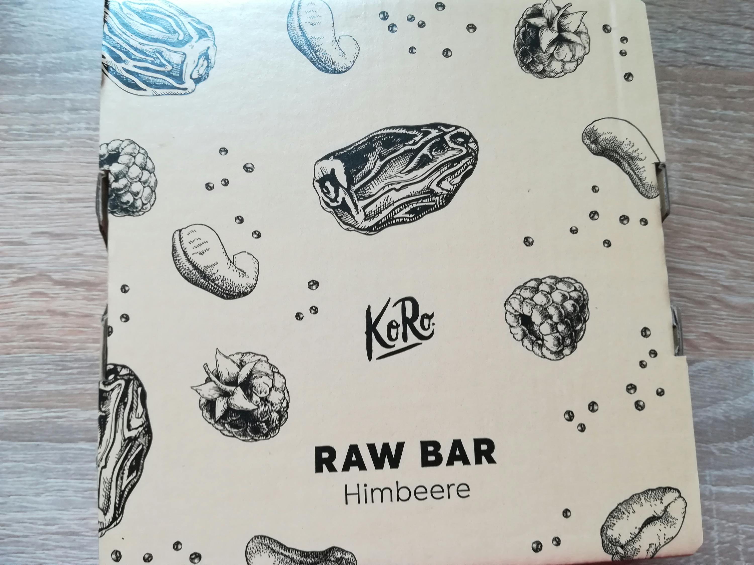 una scatola di cibo raw bar con disegni di frutta e verdura