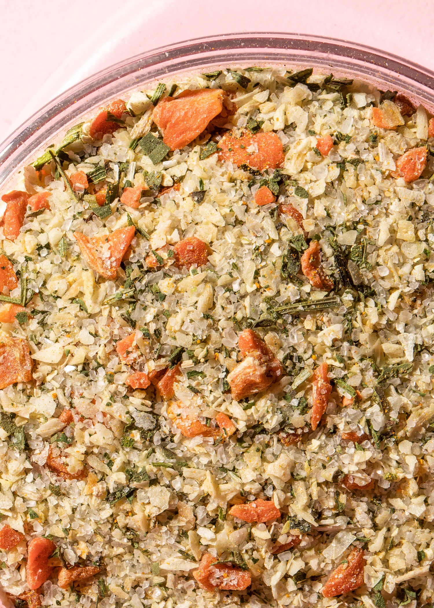 a close up of a bowl of food with carrots and other vegetables