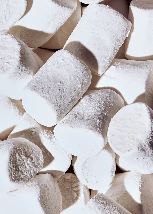 a pile of white marshmallows on a table
