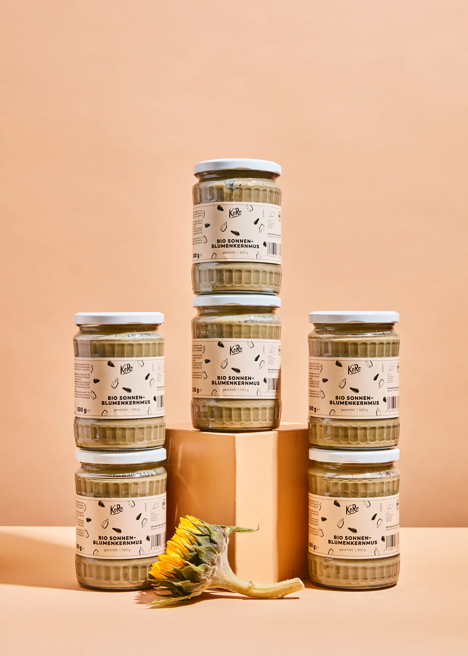 six jars of bio sonnen-sonnenblumen-mus are stacked on top of each other