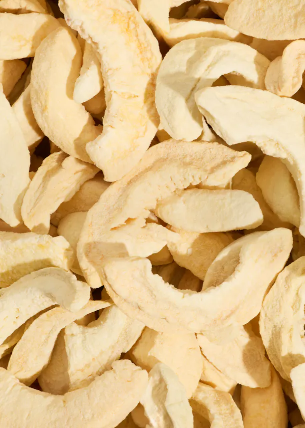 a close up of a pile of dried apples