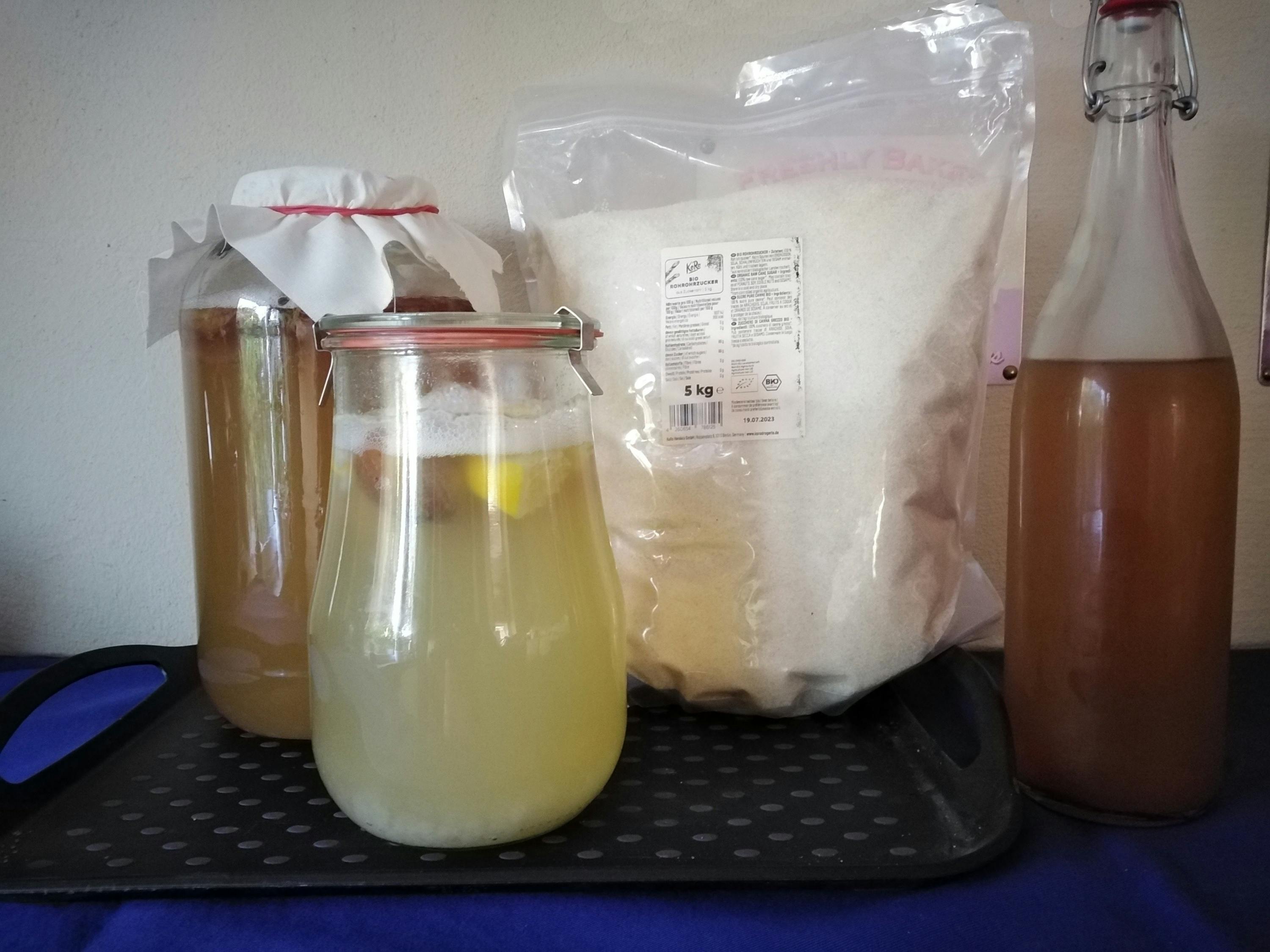 a bag of sugar is next to a jar of liquid