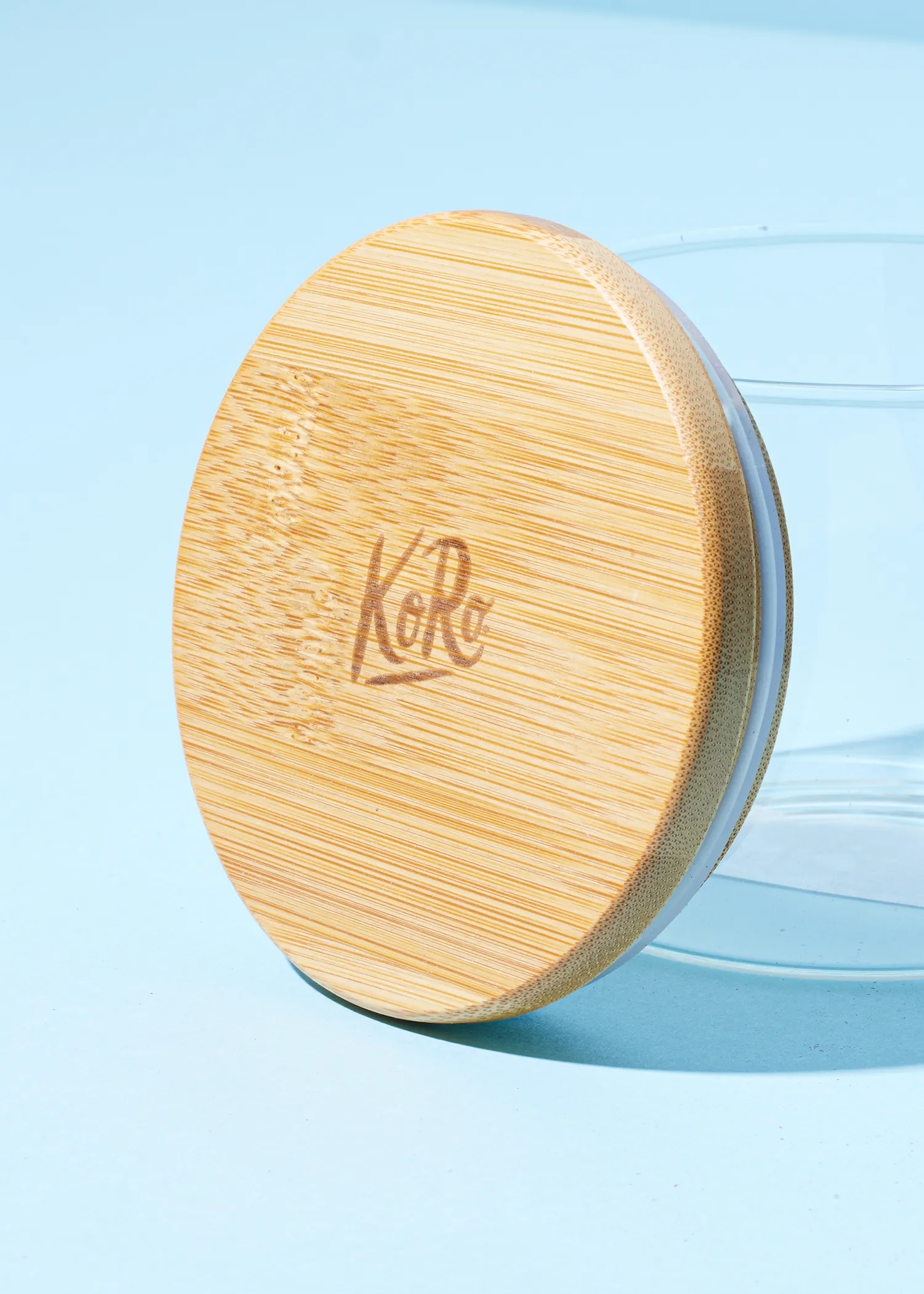 a bamboo lid with the word kore engraved on it