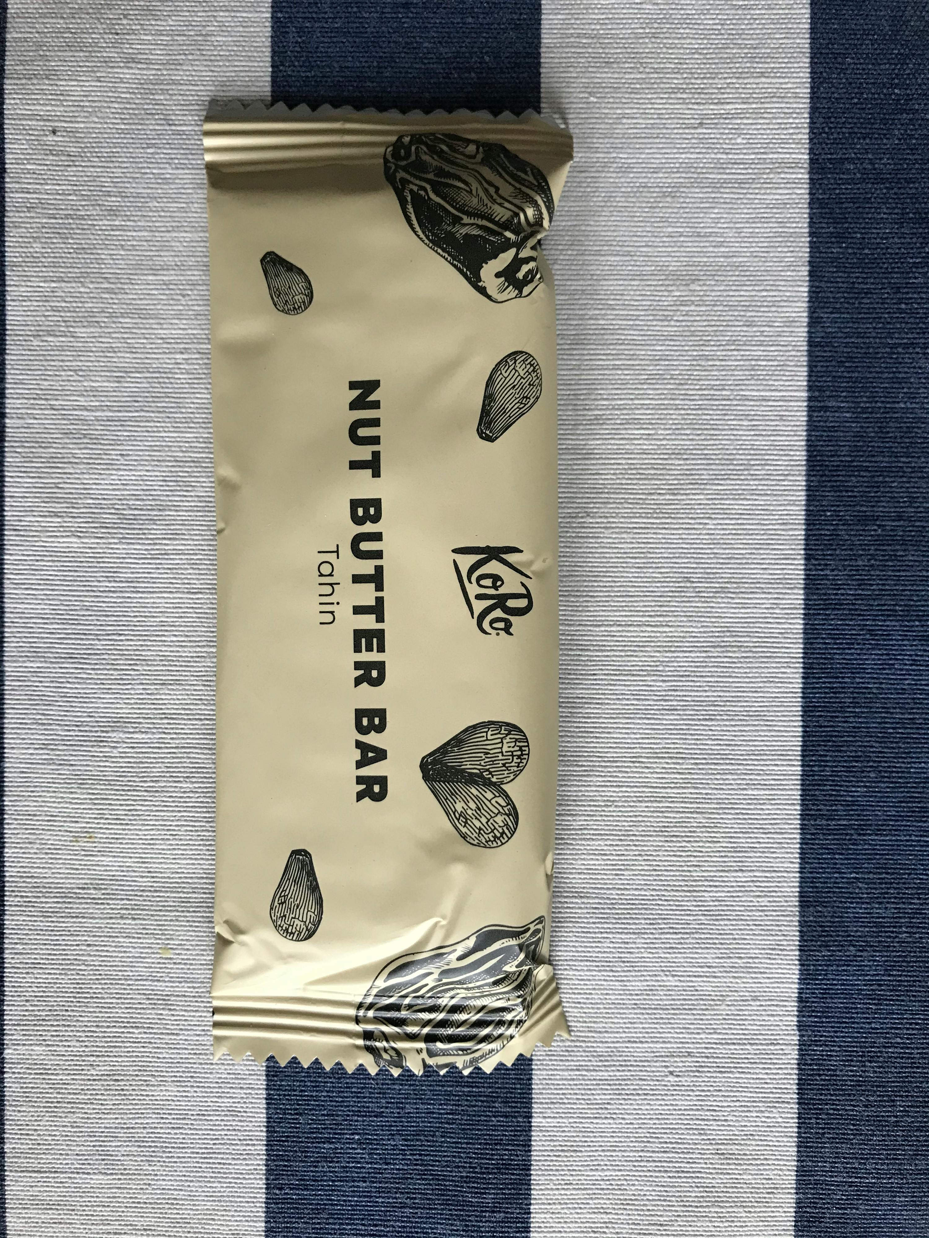 a package of nut butter bar tahin on a blue and white striped cloth