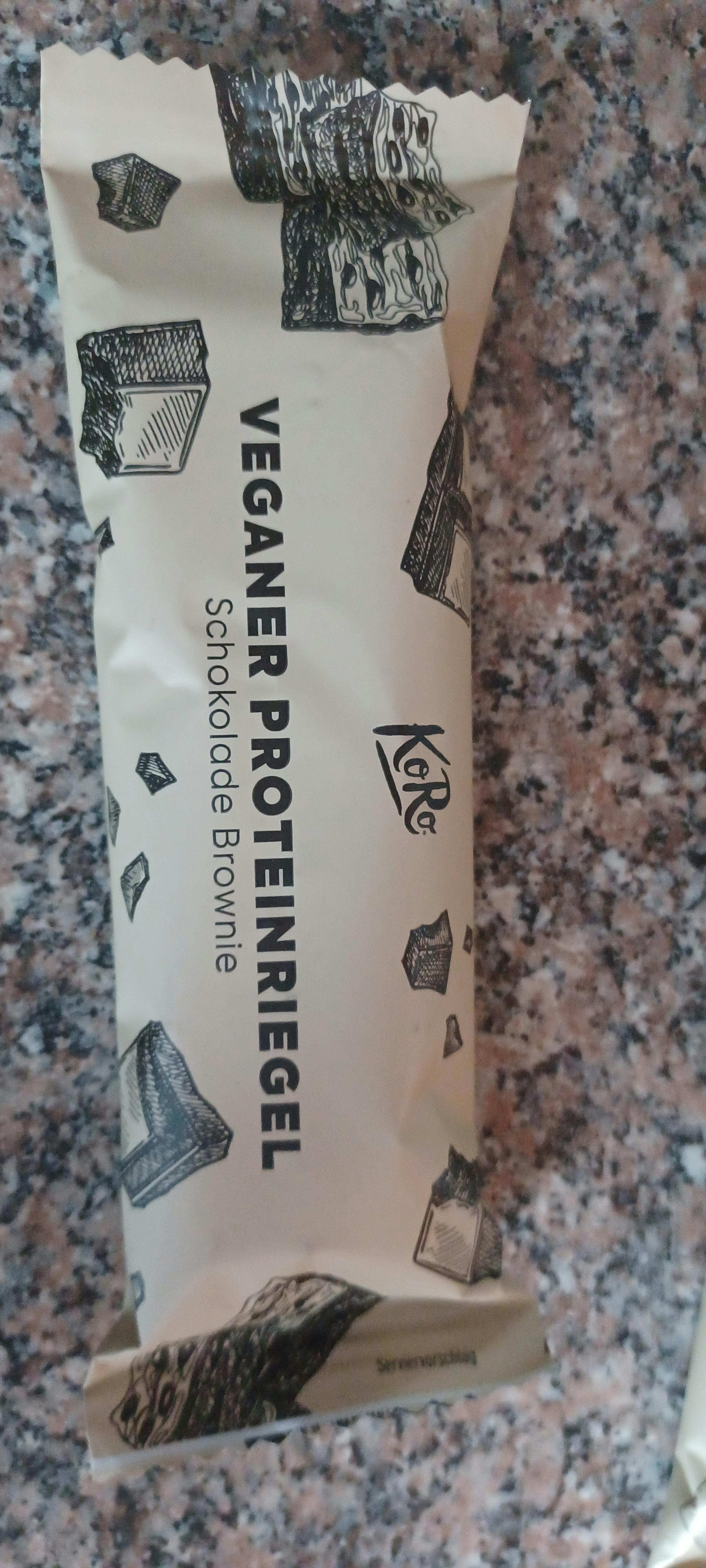 a package of veganer proteinriegel schokolade brownie sits on a counter