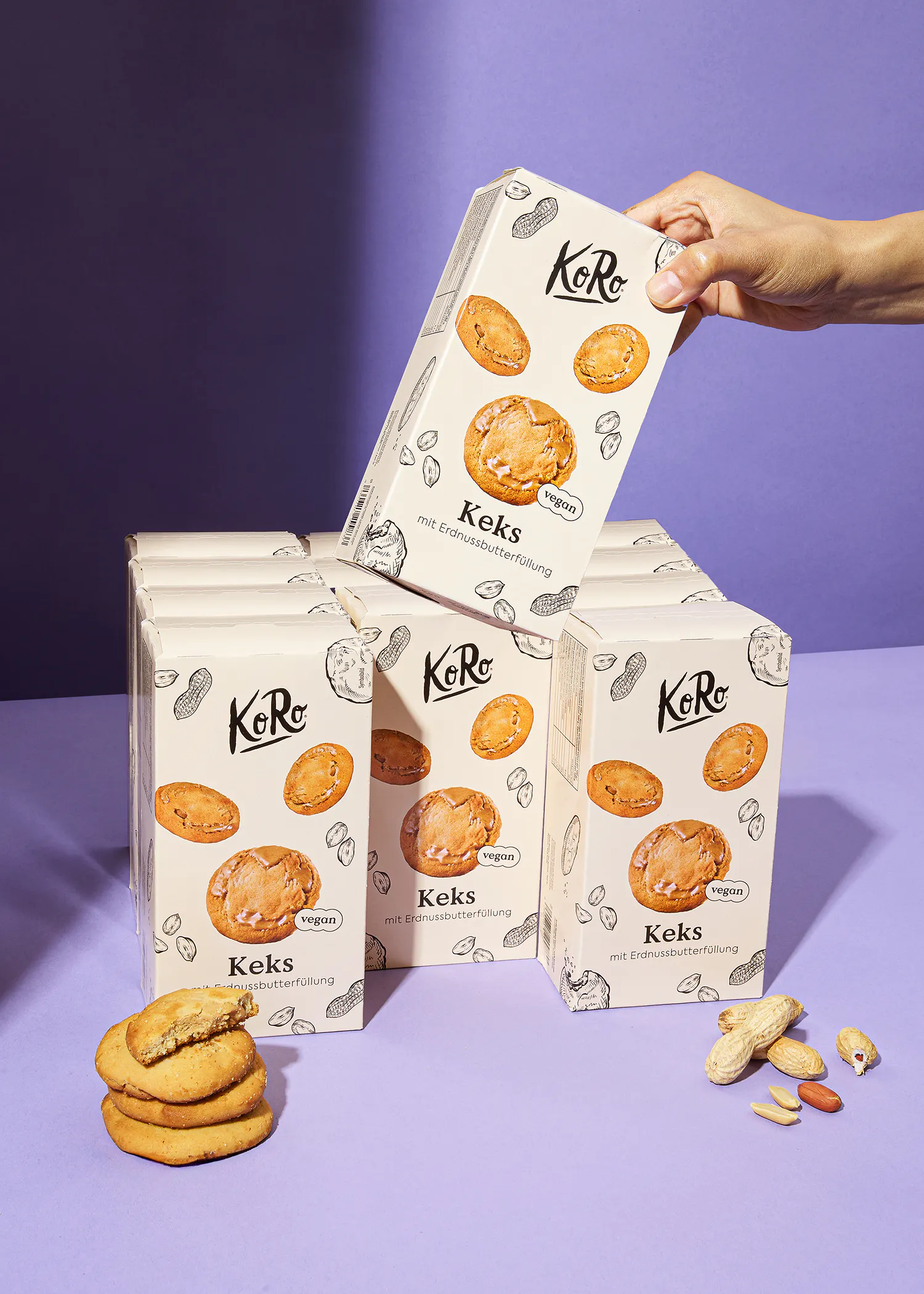 a person is holding a box that says " keks " on it