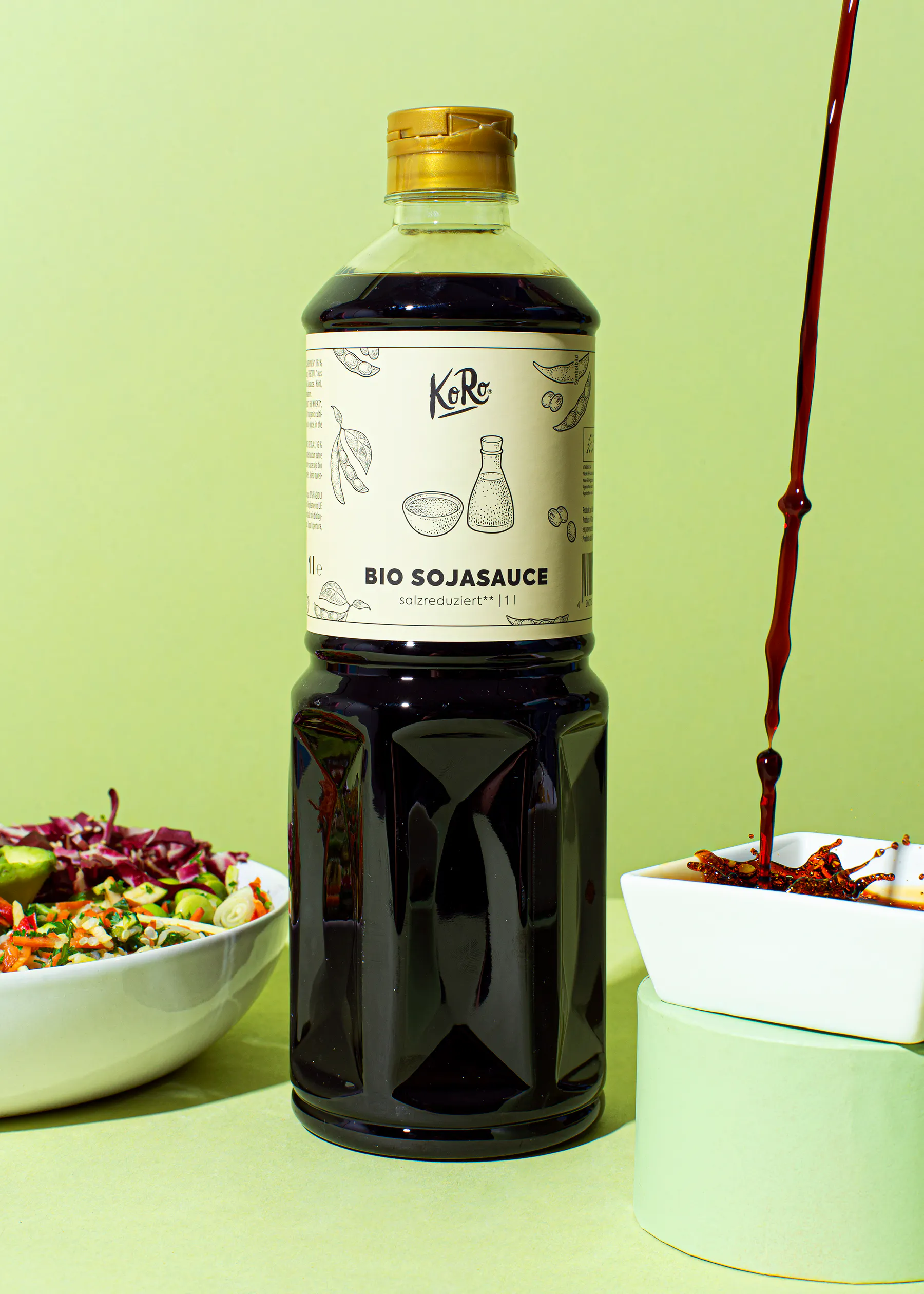 a bottle of bio sojasauce sits next to a bowl of food