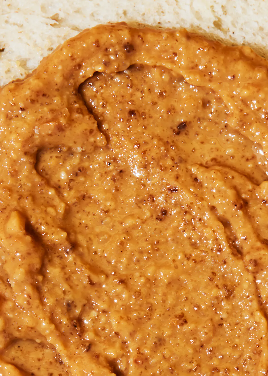 a close up of a peanut butter spread on a piece of bread