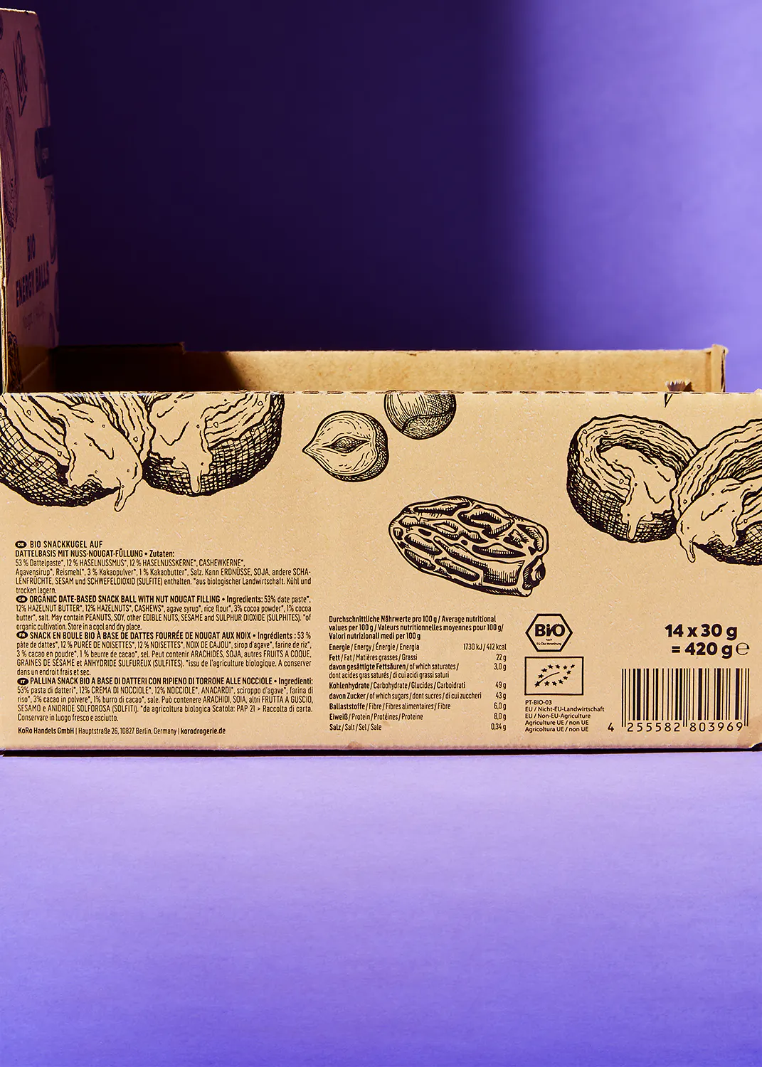 l' arrière d' une boîte de biscuits avec un dessin de noix et de dattes