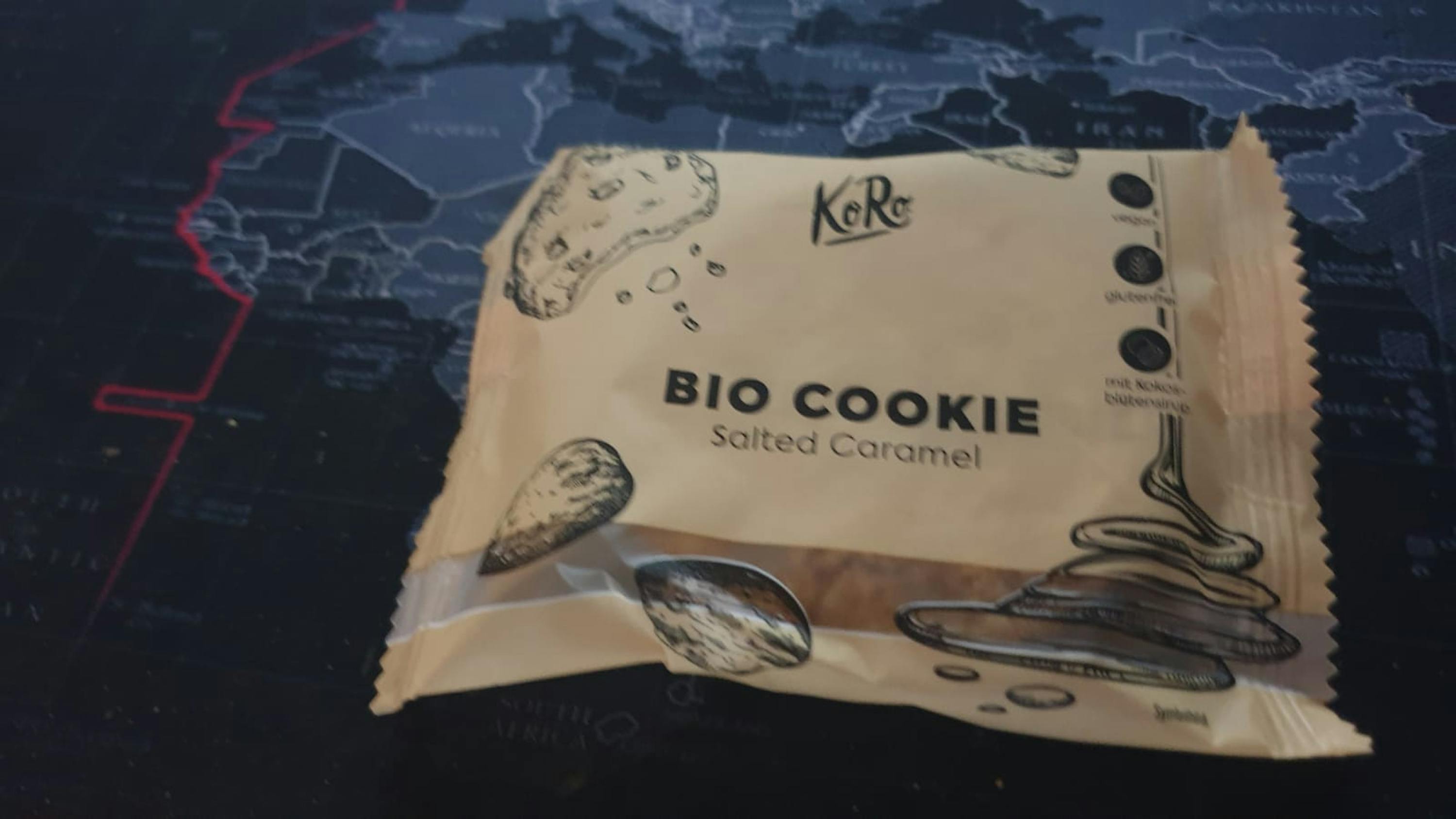 a bag of bio cookie salted caramel sits on a map