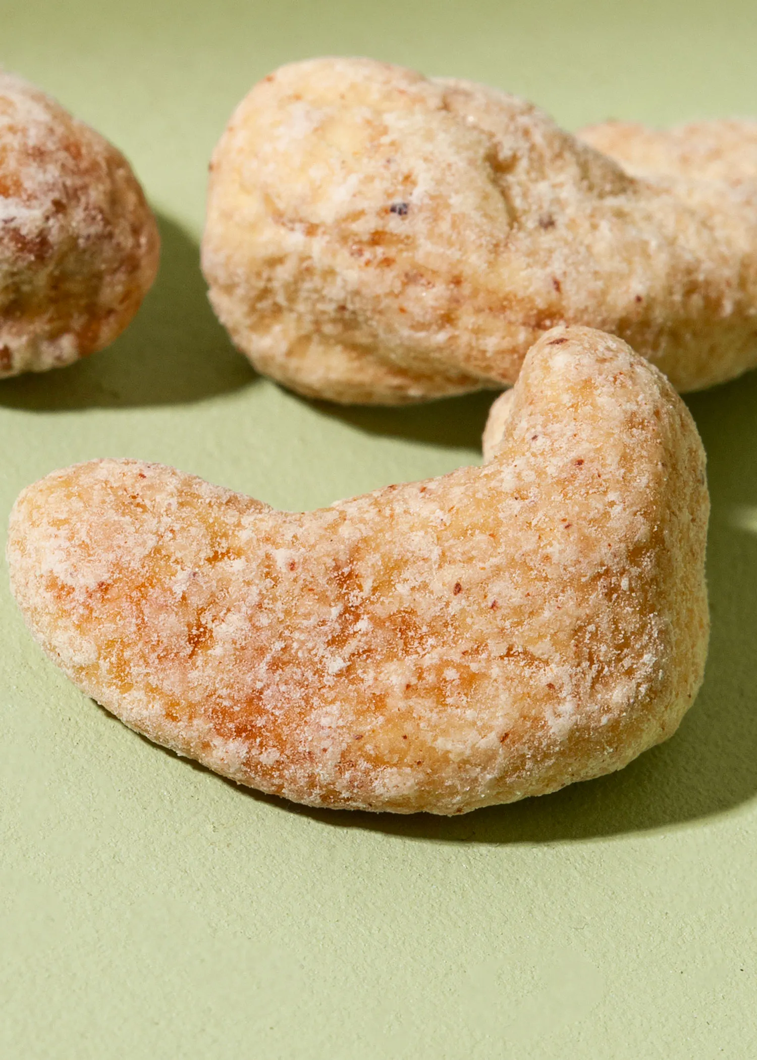 a close up of some nuts on a green surface