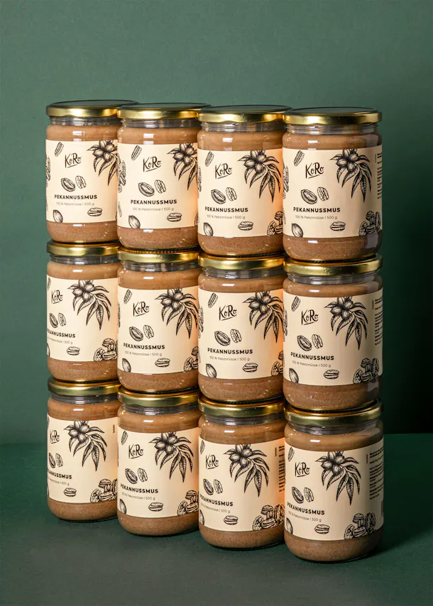 twelve jars of pecannusmus are stacked on top of each other