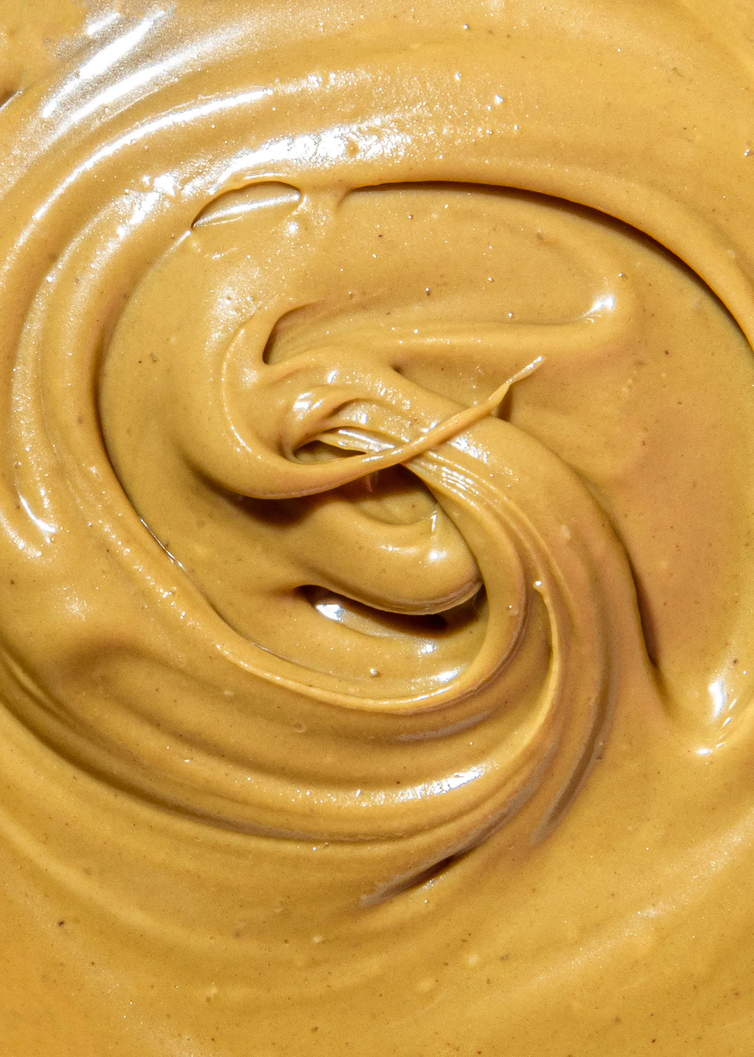 un gros plan d' un swirl de beurre de cacahuète