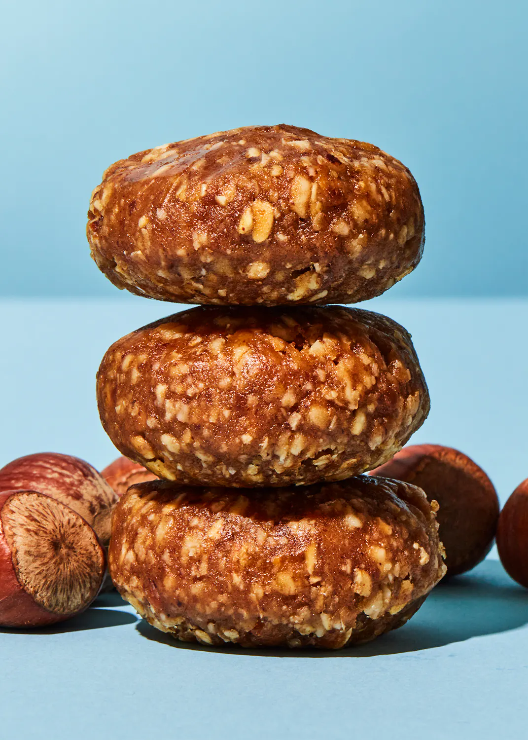 three cookies stacked on top of each other on a blue surface