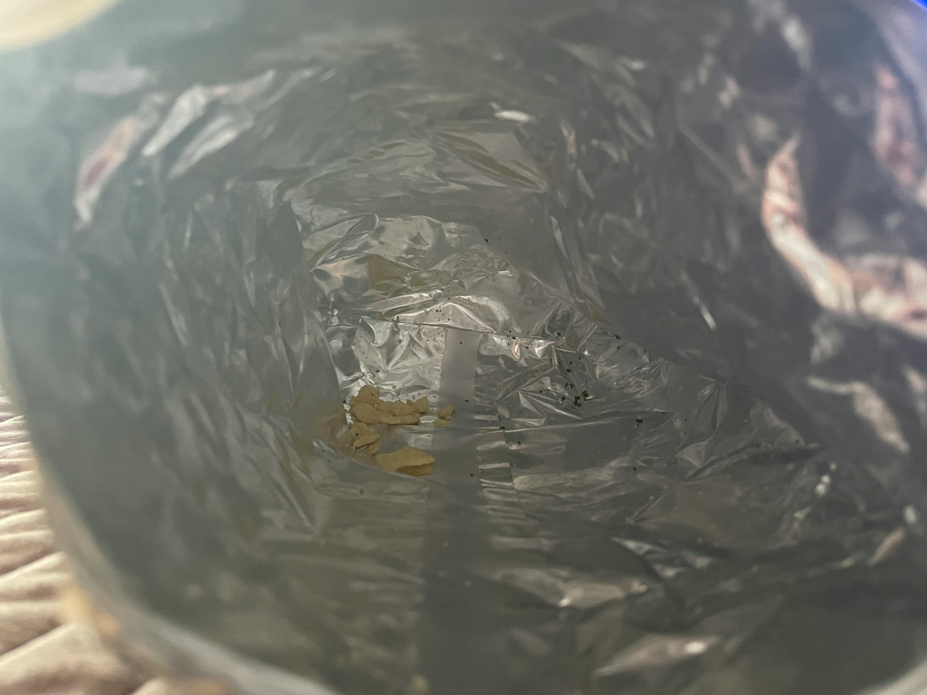 a bag of aluminum foil has a few pieces of food in it