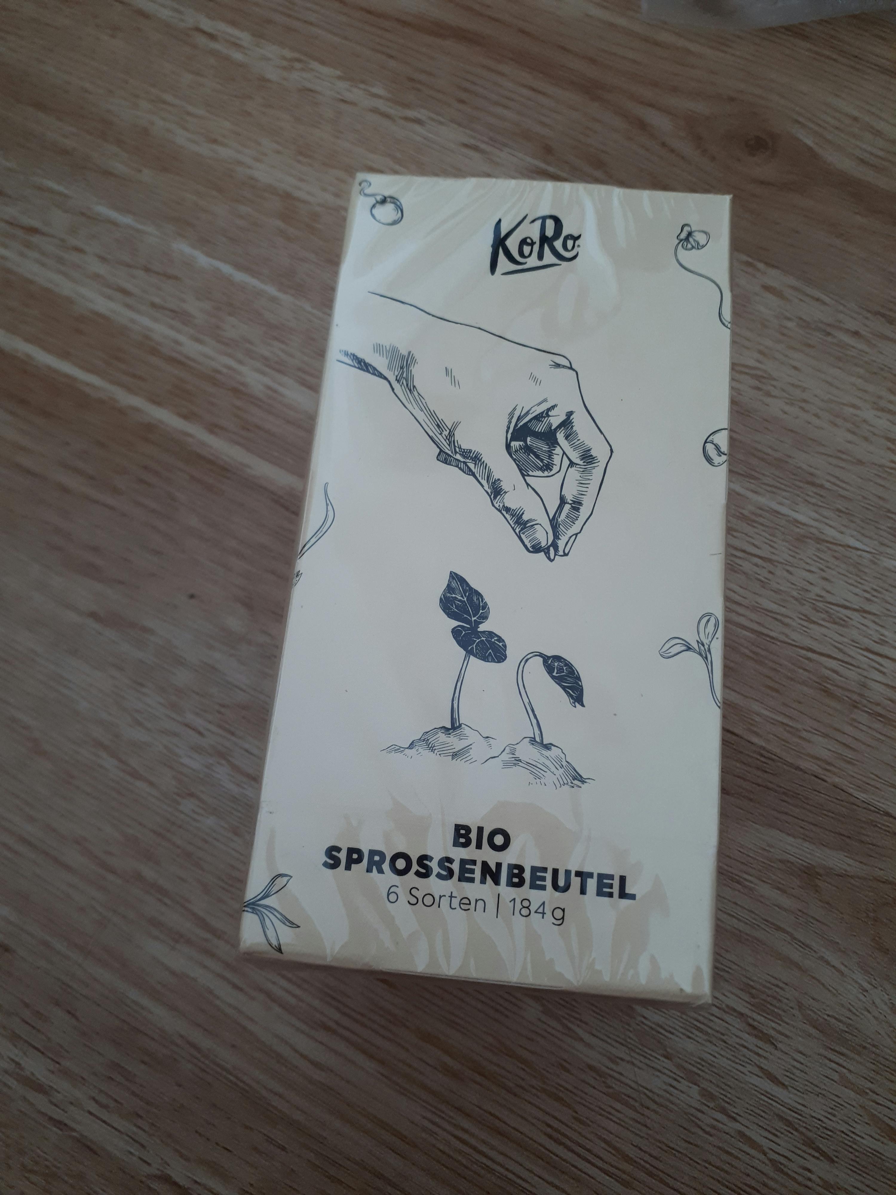 a box of bio sprossenbeutel is on a wooden table